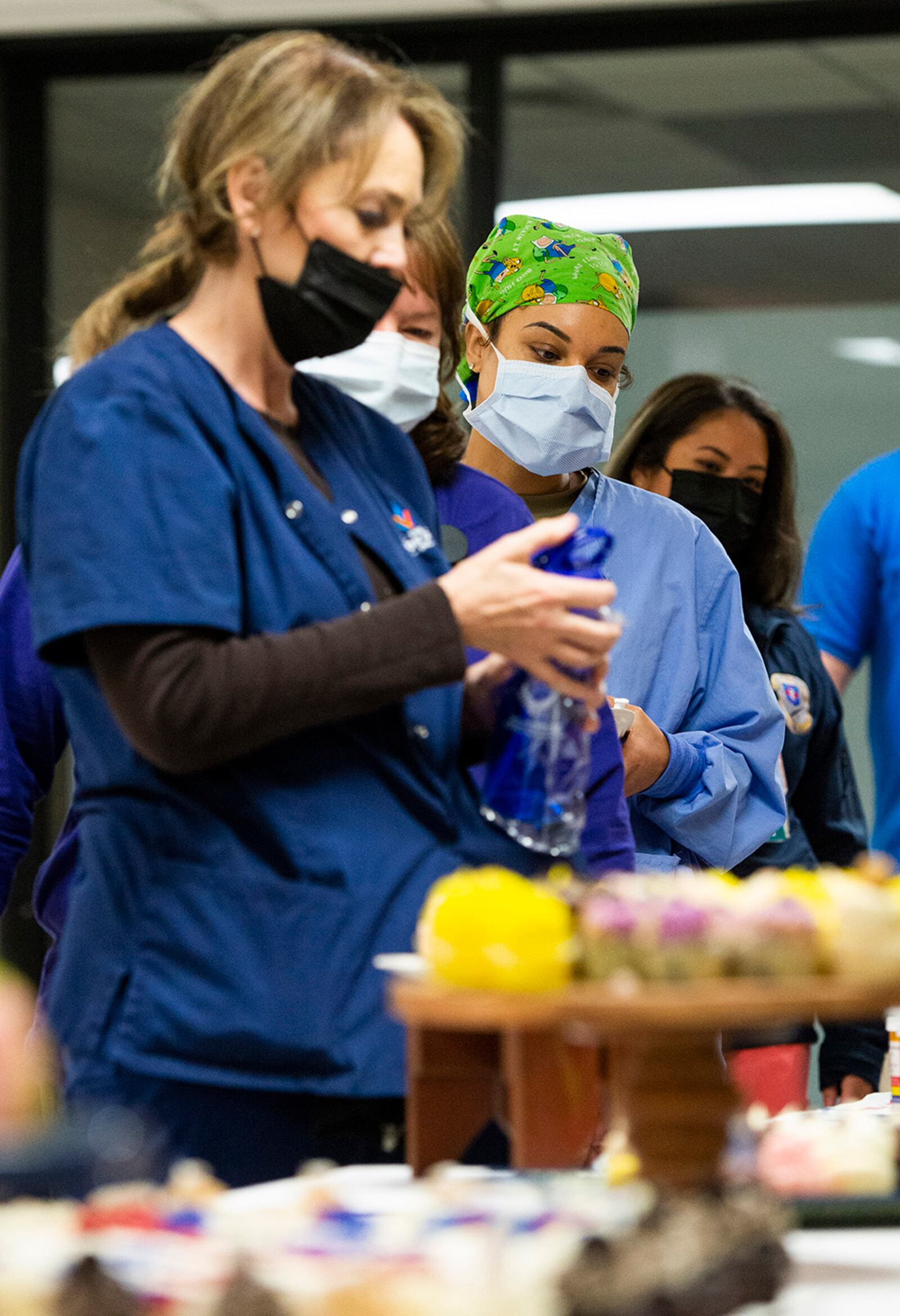 Nurses and medical technicians from the Wright-Patterson Medical Center go through the line to get a special cupcake during Florence Nightingale’s Birthday Celebration, held as part of Nurse and Medical Technician Appreciation Week. U.S. AIR FORCE PHOTO/WESLEY FARNSWORTH