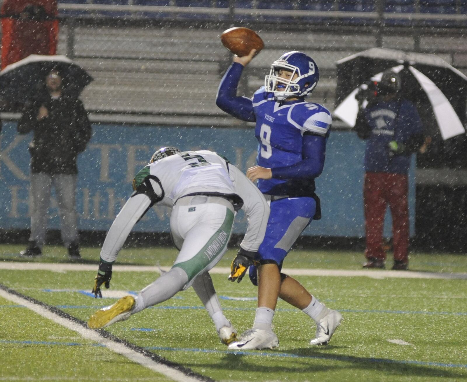 Northmont’s Jestin Jacobs (left) drew a roughing the passer penalty on Miamisburg QB Tate Vongsy. Northmont defeated host Miamisburg 21-6 in a Week 10 high school football game on Friday, Oct. 26, 2018. MARC PENDLETON / STAFF