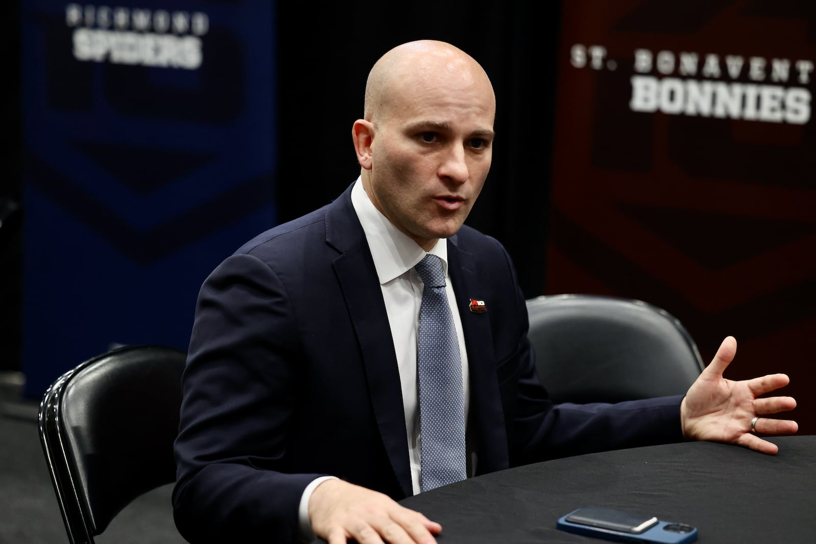 George Washington coach Chris Caputo talks to reporters at Atlantic 10 Conference Media Day on Thursday, Oct. 13, 2022, at the Barclays Center in Brooklyn, N.Y. David Jablonski/Staff