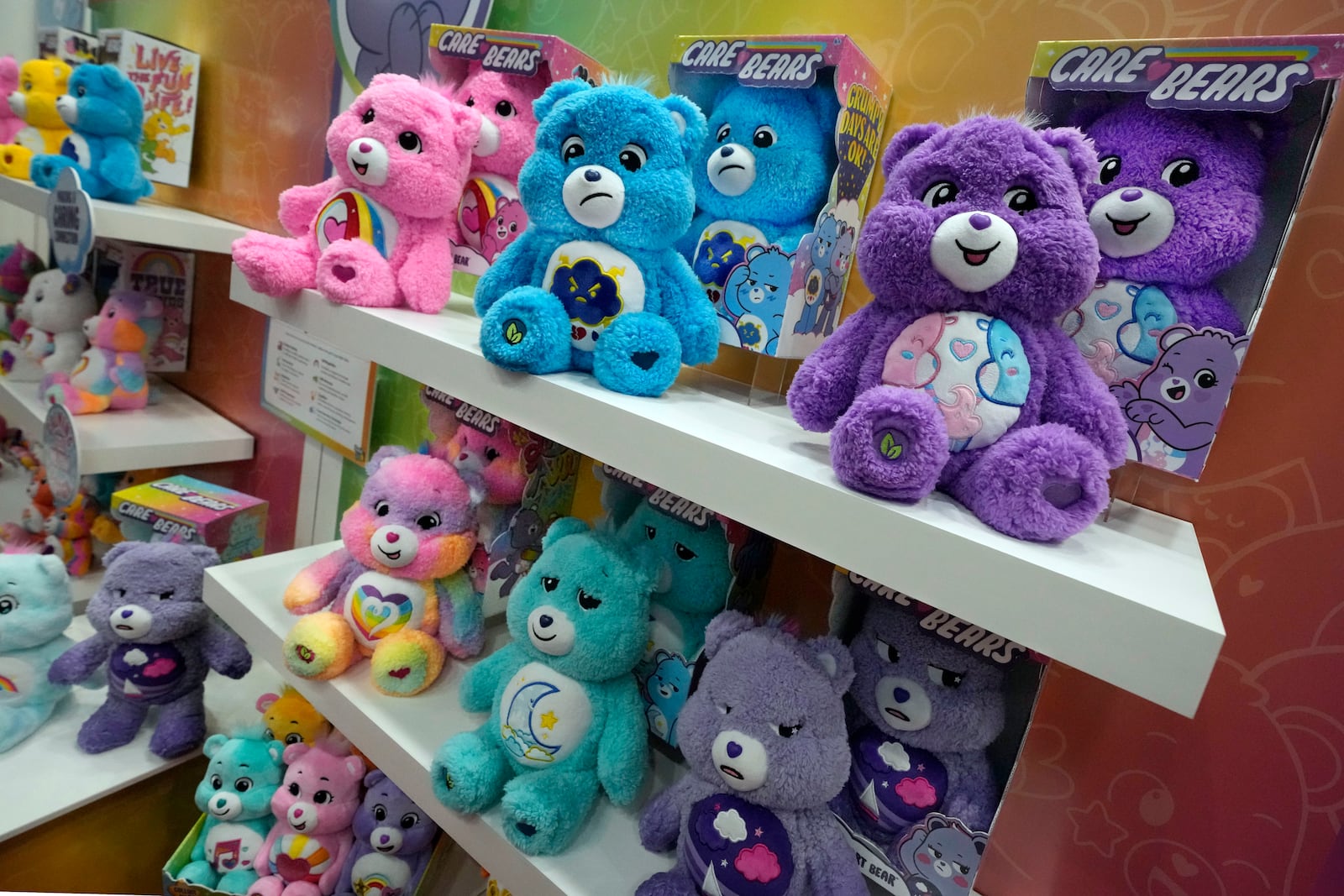 Care Bears, from Basic Fun!, are displayed at the Toy Fair, in New York's Javits Center, Monday, March 3, 2025. (AP Photo/Richard Drew)