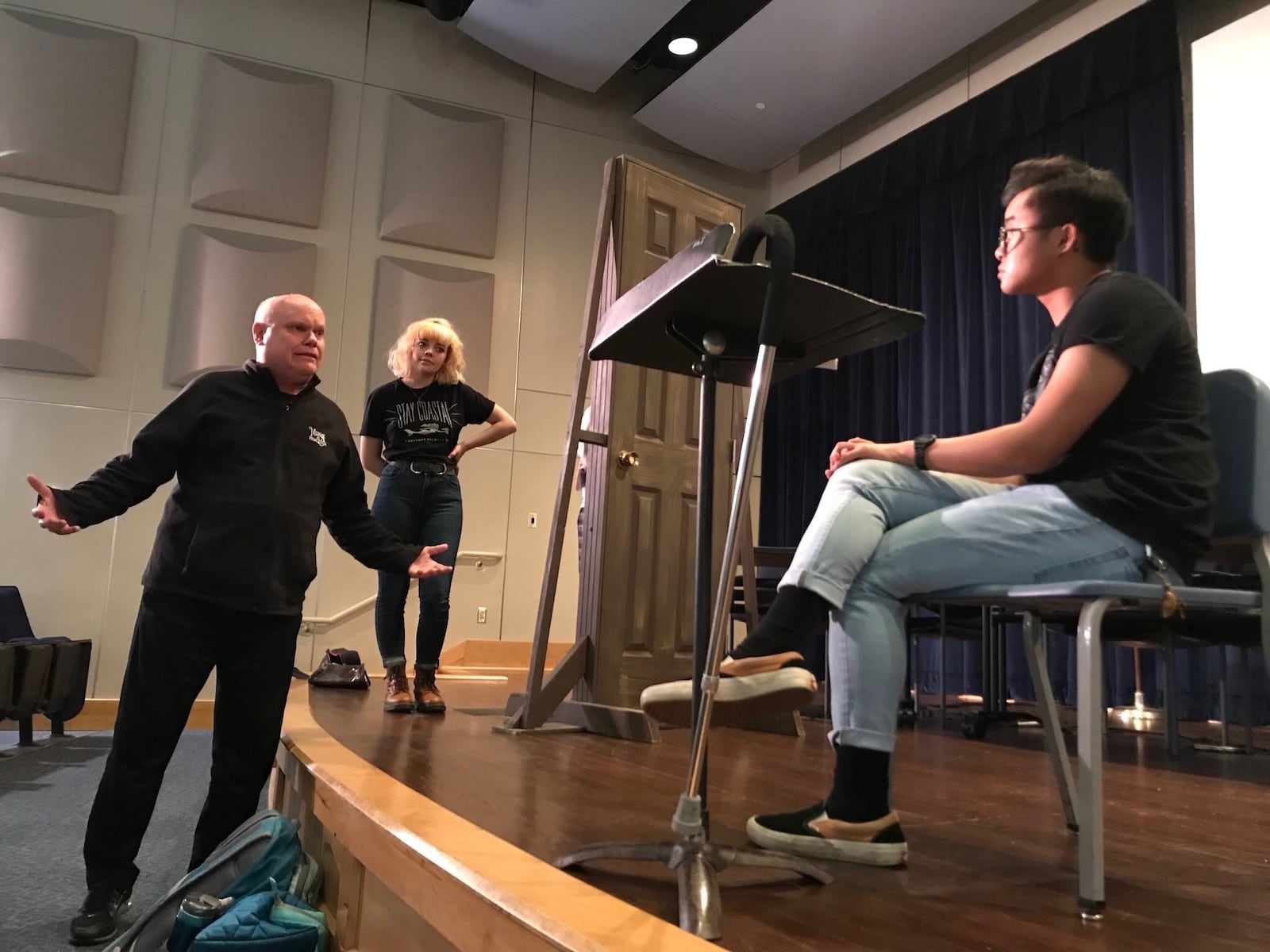 Veteran actor Michael Lippert coaches Allison Hoffmann and NiNi Denker (seated) in the 2018 Fairmont High School production of “The Elephant Man.” CONTRIBUTED