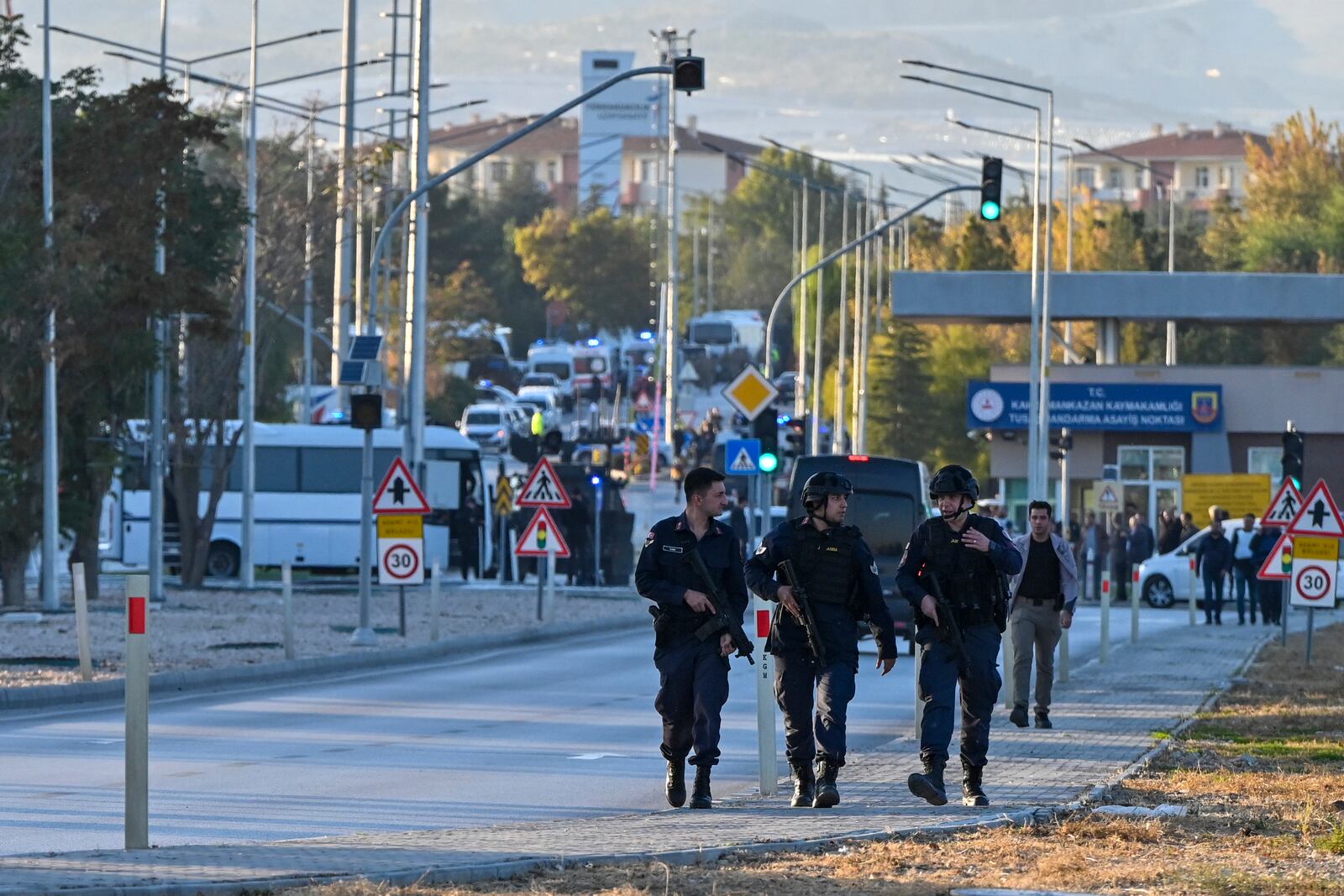 Emergency and security teams are deployed outside of Turkish Aerospace Industries Inc. at the outskirts of Ankara, Turkey, Wednesday, Oct. 23, 2024. (AP Photo/Mert Gokhan Koc)