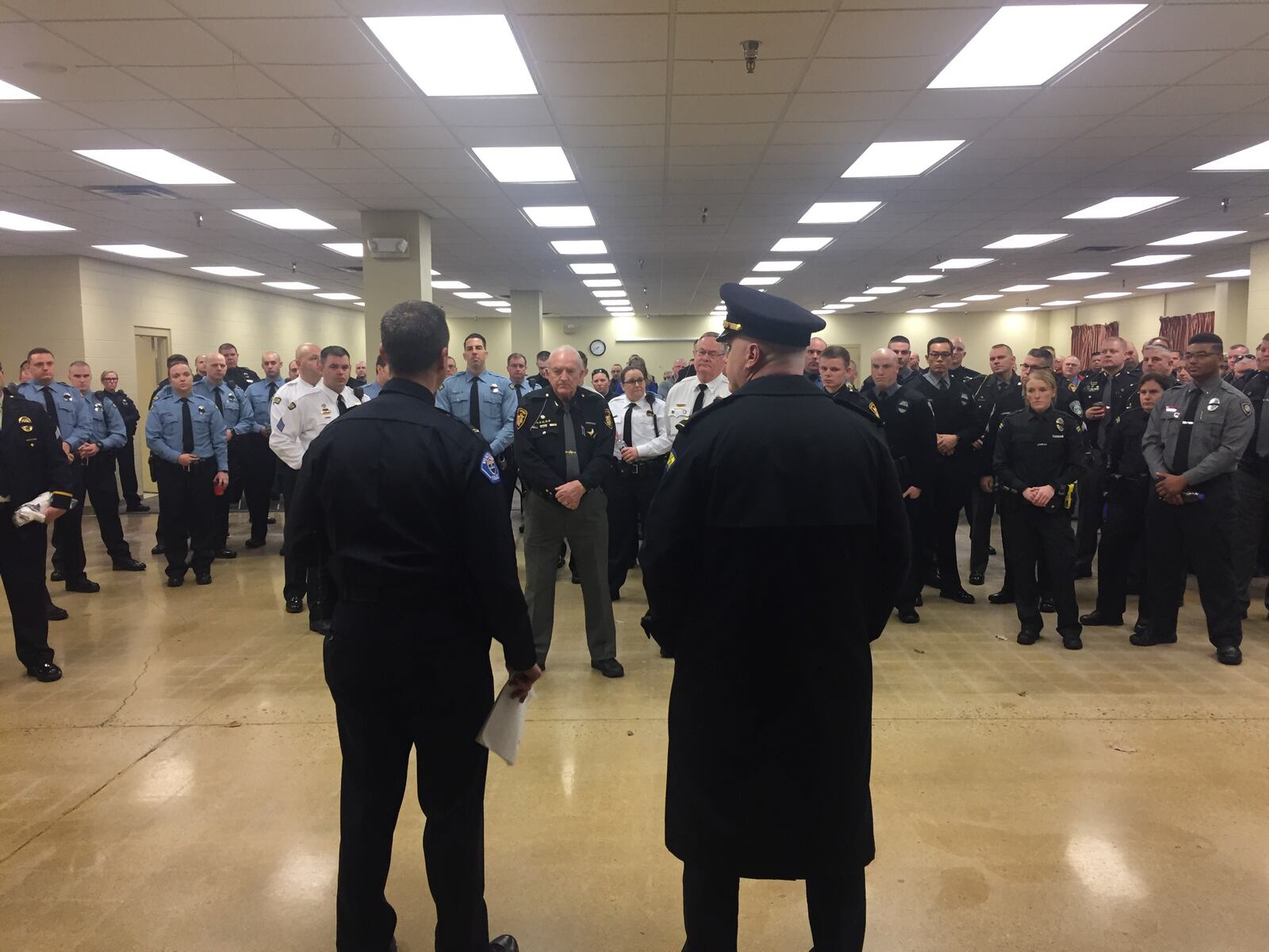 Officers receive instructions before heading to Westerville for the funeral of two officers killed in the line of duty last Saturday. (Jarod Thrush/Staff)