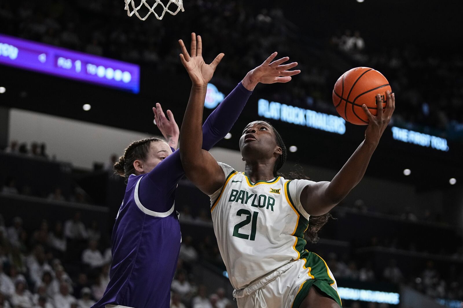 Baylor center Aaronette Vonleh (21) shoots as TCU center Sedona Prince, left, defends in the first half of an NCAA college basketball game in Waco, Texas, Sunday, March 2, 2025. (AP Photo/Tony Gutierrez)