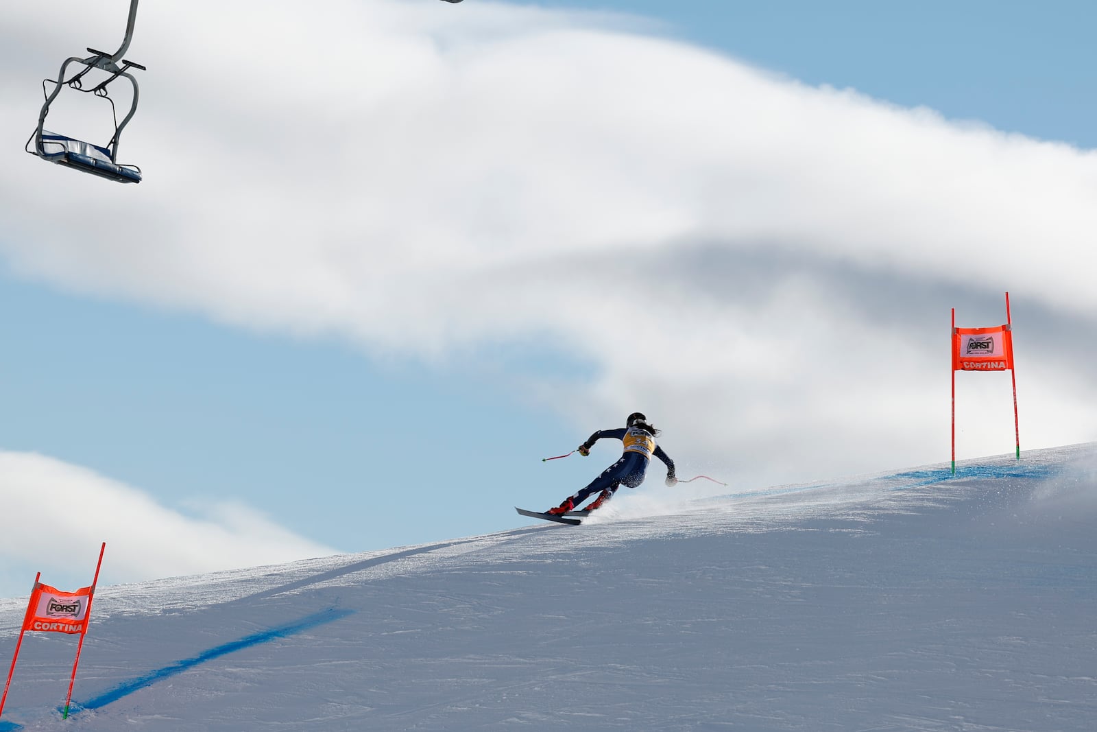 United States' Isabella Wright speeds down the course during an alpine ski, women's World Cup downhill training, in Cortina d'Ampezzo, Italy, Thursday, Jan. 16, 2025. (AP Photo/Alessandro Trovati)