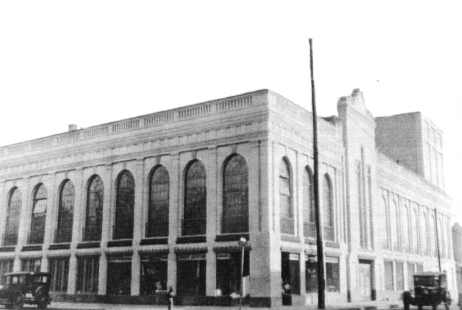 Palace Theatre opened on Christmas Day in 1927. Though plain-looking on the outside, the Palace was jumping on the inside. Patrons had the choice of watching movies or vaudeville acts in the 1800 seat theater, or dance the night away in one of the largest ballrooms in the Midwest. Cars would sometimes have to park blocks away when a particularly good picture or vaudeville act came to town. Photo from the book "When Dayton went to the Movies" by Curt Dalton.