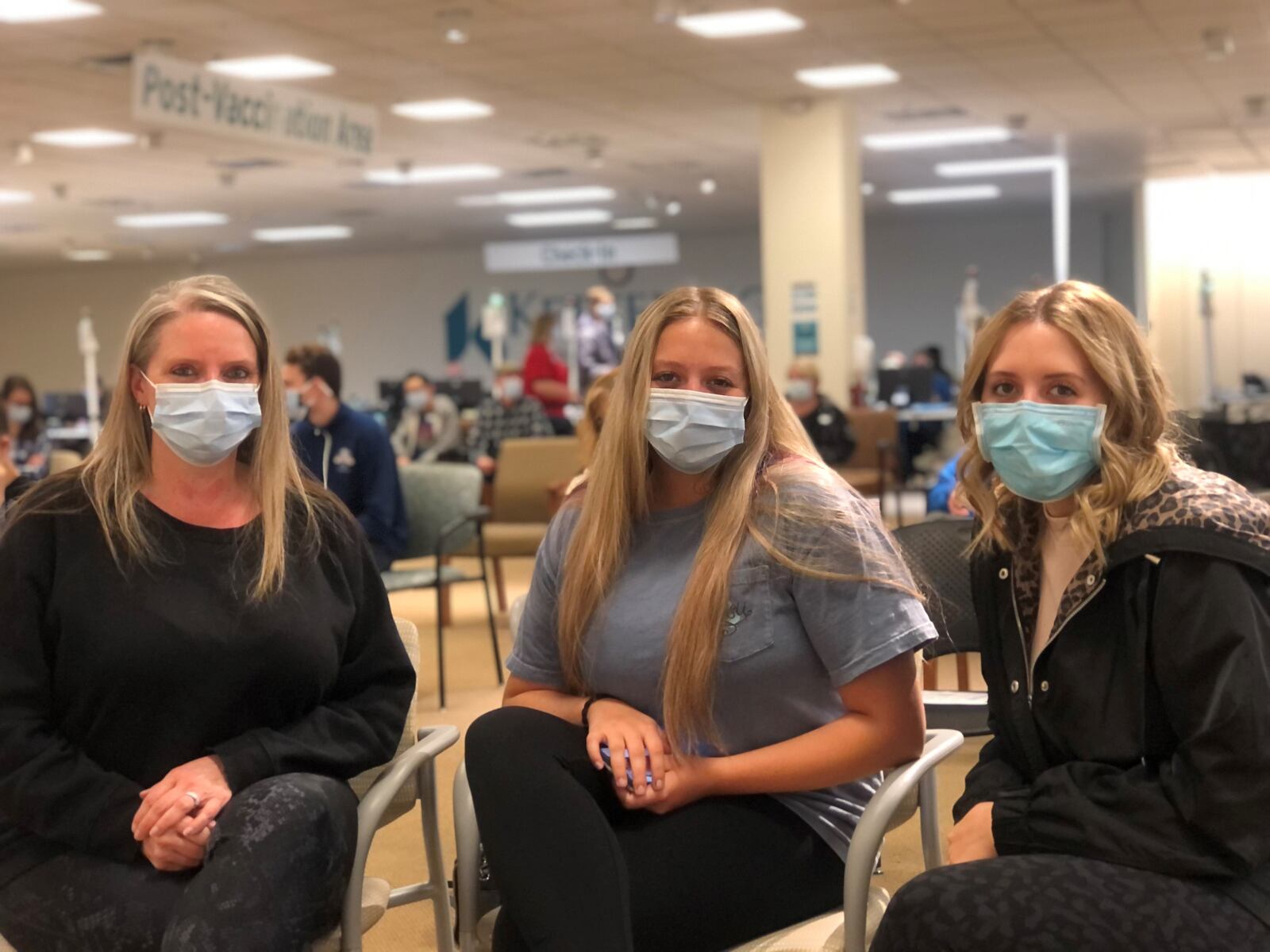 Missy Kozee and her daughters Jordyn, 17, and Alyssa, 22. Kozee was vaccinated a few weeks ago. Alyssa, who is in nursing school, was vaccinated in January. Jordyn received her first shot at a Kettering Health Network clinic on Friday. CORNELIUS FROLIK / STAFF