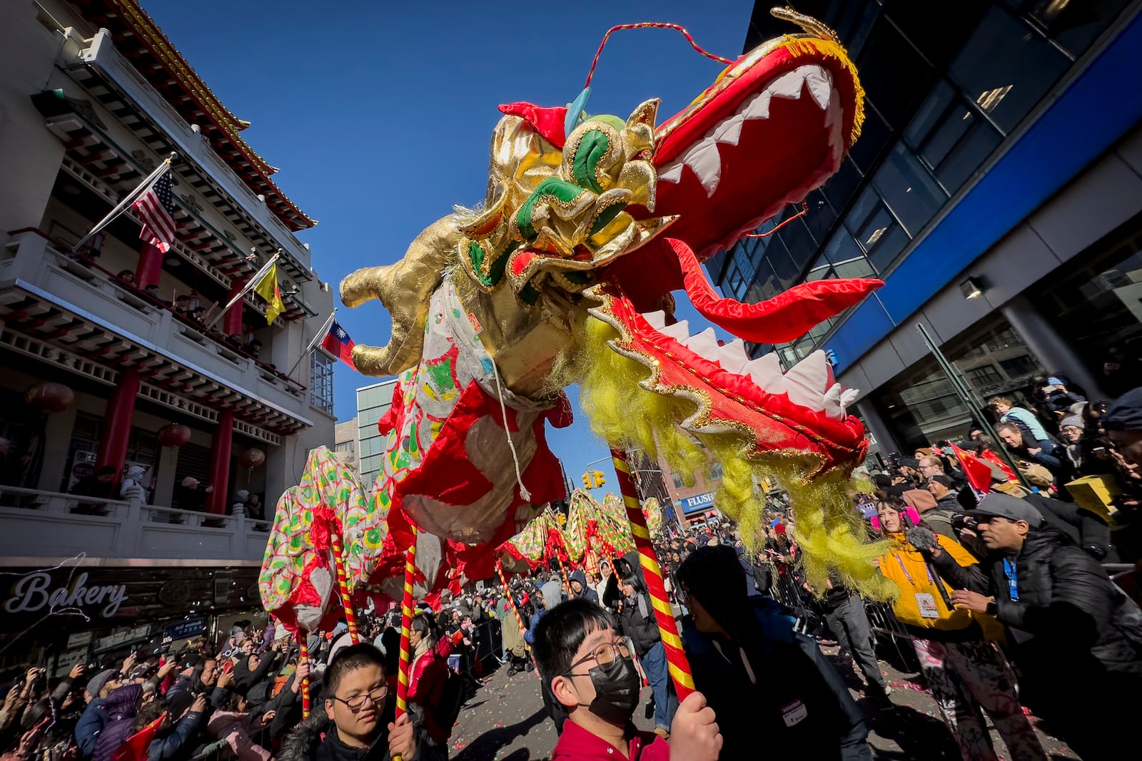 FILE - A dragon puppet is marched down Mott Street during the Lunar New Year parade in Manhattan's Chinatown, Sunday, Feb. 25, 2024, in New York. (AP Photo/John Minchillo, File)