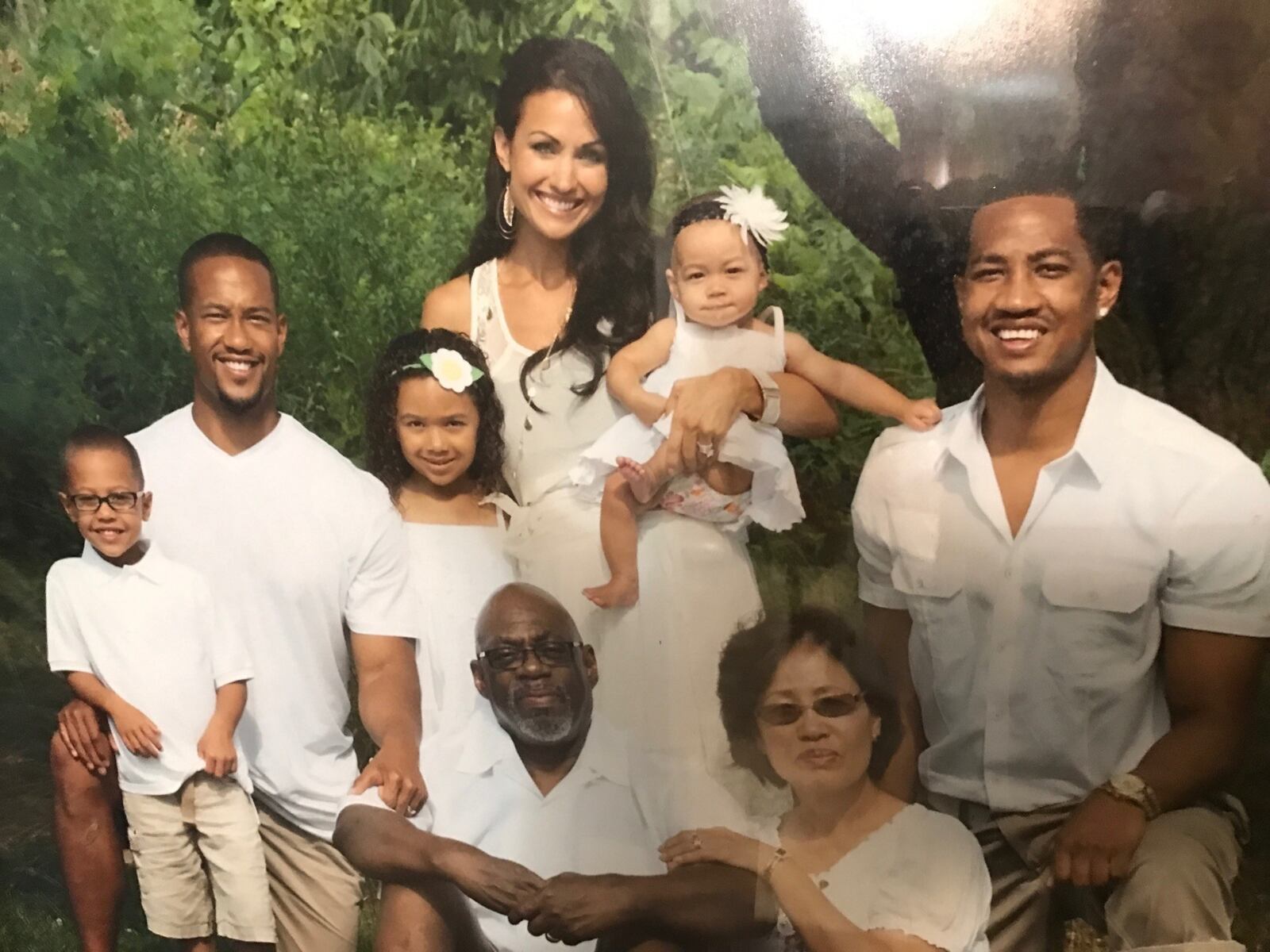 The Freeman family a few years ago.  Michael Sr. and Chong , Marcus Freeman’s parents (in front.)  (Back row) Marcus (far left); his wife Joanna with three of their now six children  and brother Michael Jr.(on right). CONTRIBUTED