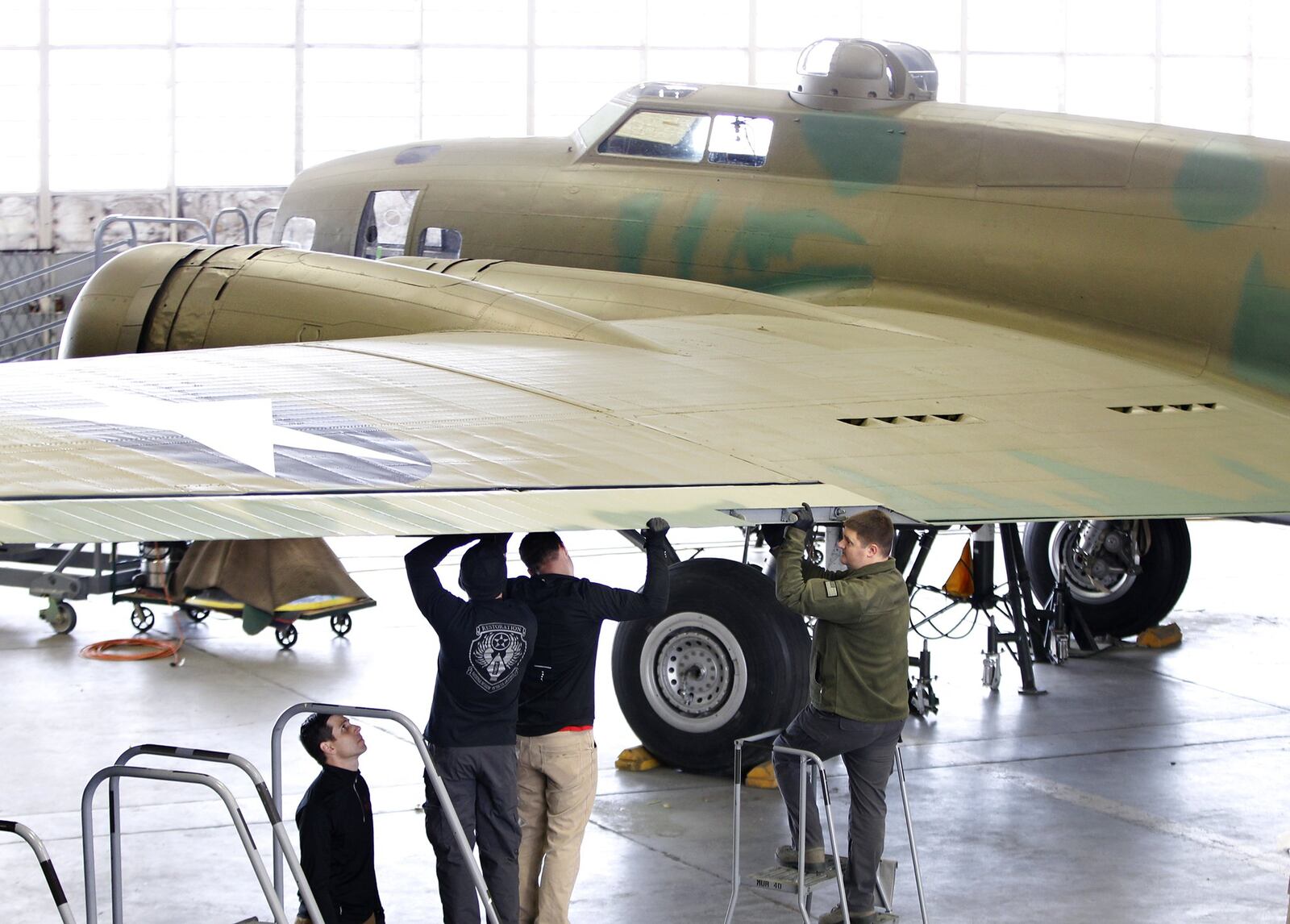 The flight controls for the B-17F Memphis Belle were installed Thursday by restoration specialists at the National Museum of the U.S. Air Force. The plane was the first U.S. Army Air Forces heavy bomber to return to the United States after completing 25 missions over Europe. When restoration is completed it will be placed on public display at the museum May 17. LISA POWELL / STAFF