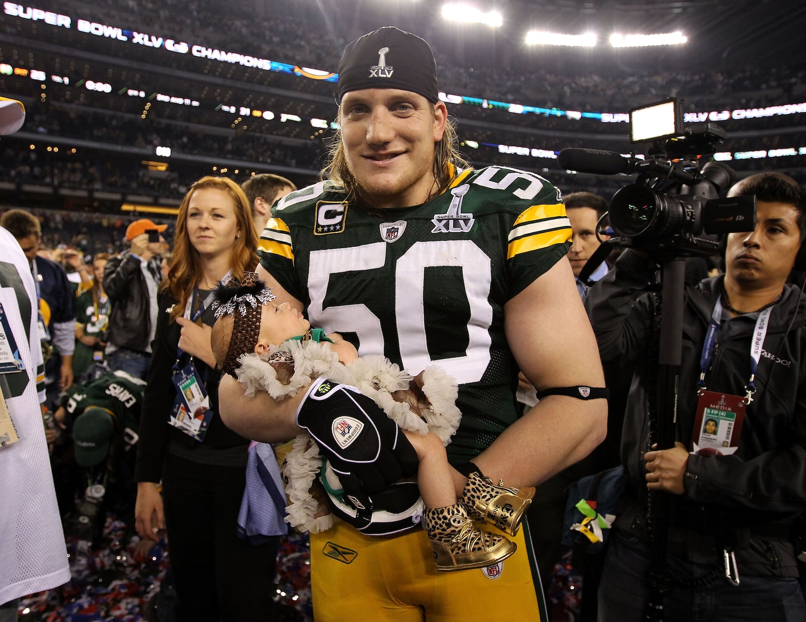 A.J. Hawk celebrated the Packers' Super Bowl win with his baby daughter Lennon after winning Super Bowl XLV 31-25 against the Pittsburgh Steelers at Cowboys Stadium on February 6, 2011 in Arlington, Texas.  (Photo by Al Bello/Getty Images)