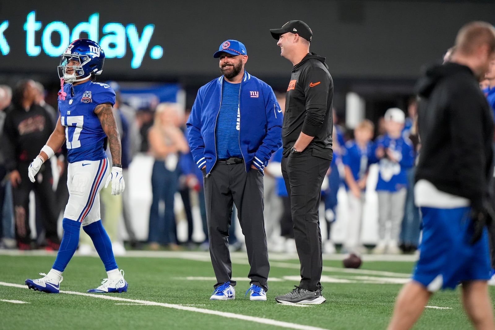 Cincinnati Bengals head coach Zac Taylor, center right, and New York Giants head coach Brian Daboll talk on the field before an NFL football game, Sunday, Oct. 13, 2024, in East Rutherford, N.J. (AP Photo/Frank Franklin II)