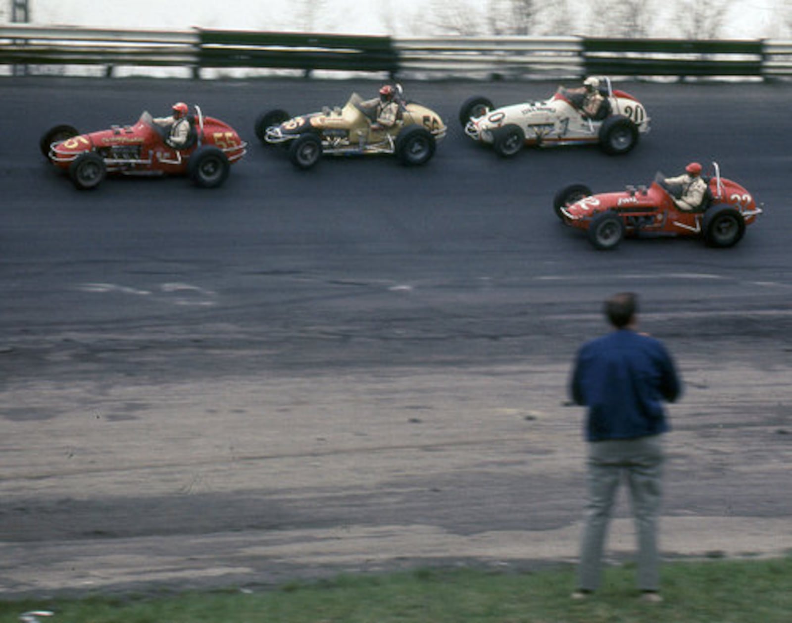 Daytonian Bud Tinglestad, 55, leads Chuck Booth, 56, Charlie Masters, 20, and Dee Jones, 32, during the third head of a USAC sprint car race at the Dayton Speedway on April 13, 1969