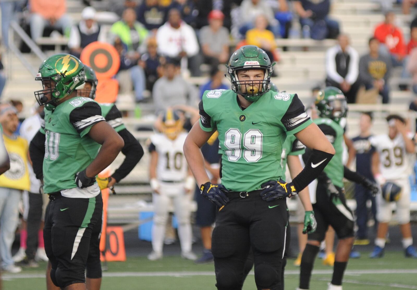 Northmont’s Marcus Burks (left) and Gabe Newburg (99) were part of a defense that shut down previously unbeaten Springfield 25-7 in a Week 7 high school football game on Friday, Oct. 5, 2018. MARC PENDLETON / STAFF