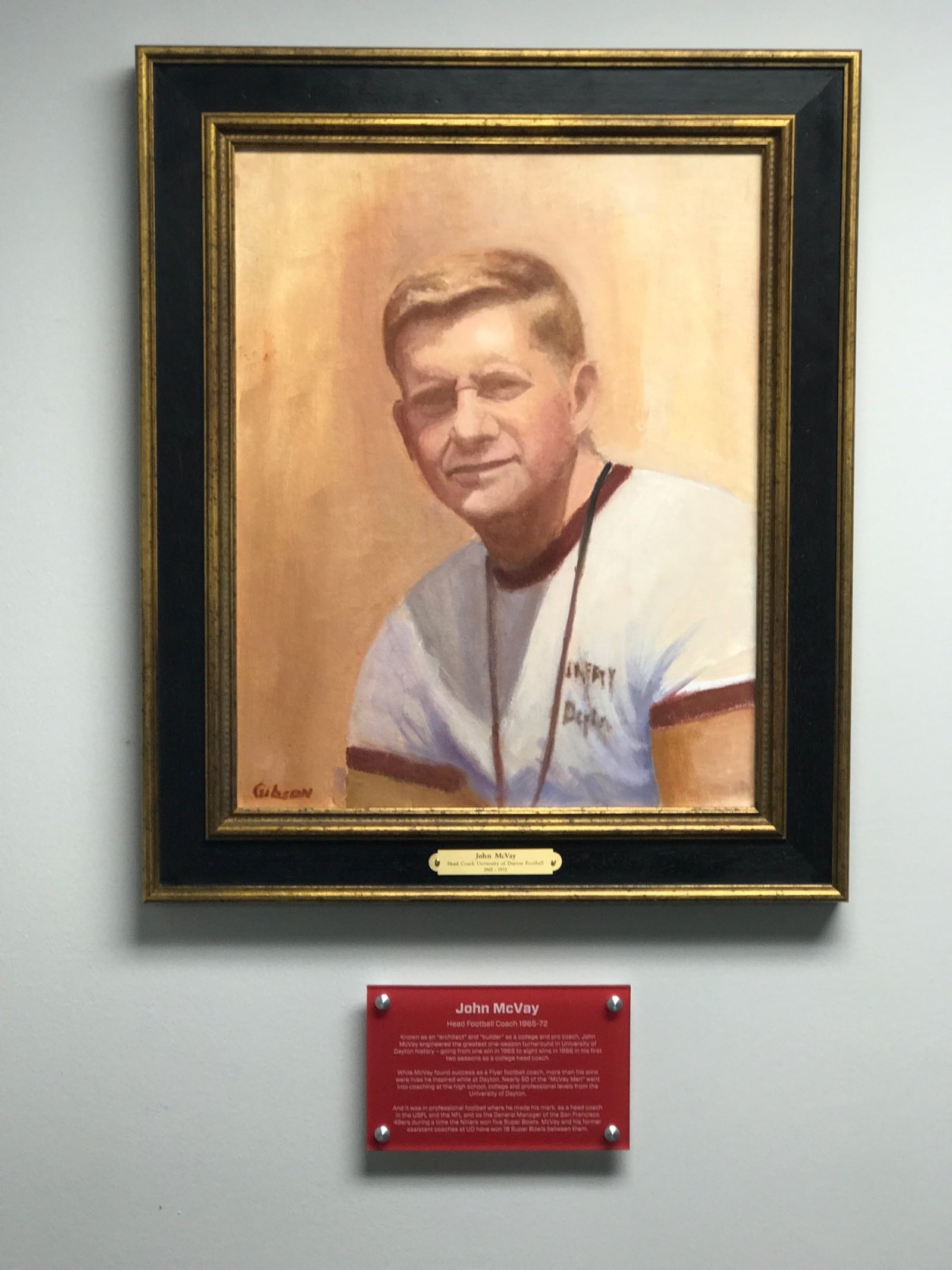 Portrait of former University of Dayton football coach John McVay that was done by Kettering artist Greg Gibson and just hung in UD football offices last week. Tom Archdeacon/CONTRIBUTED