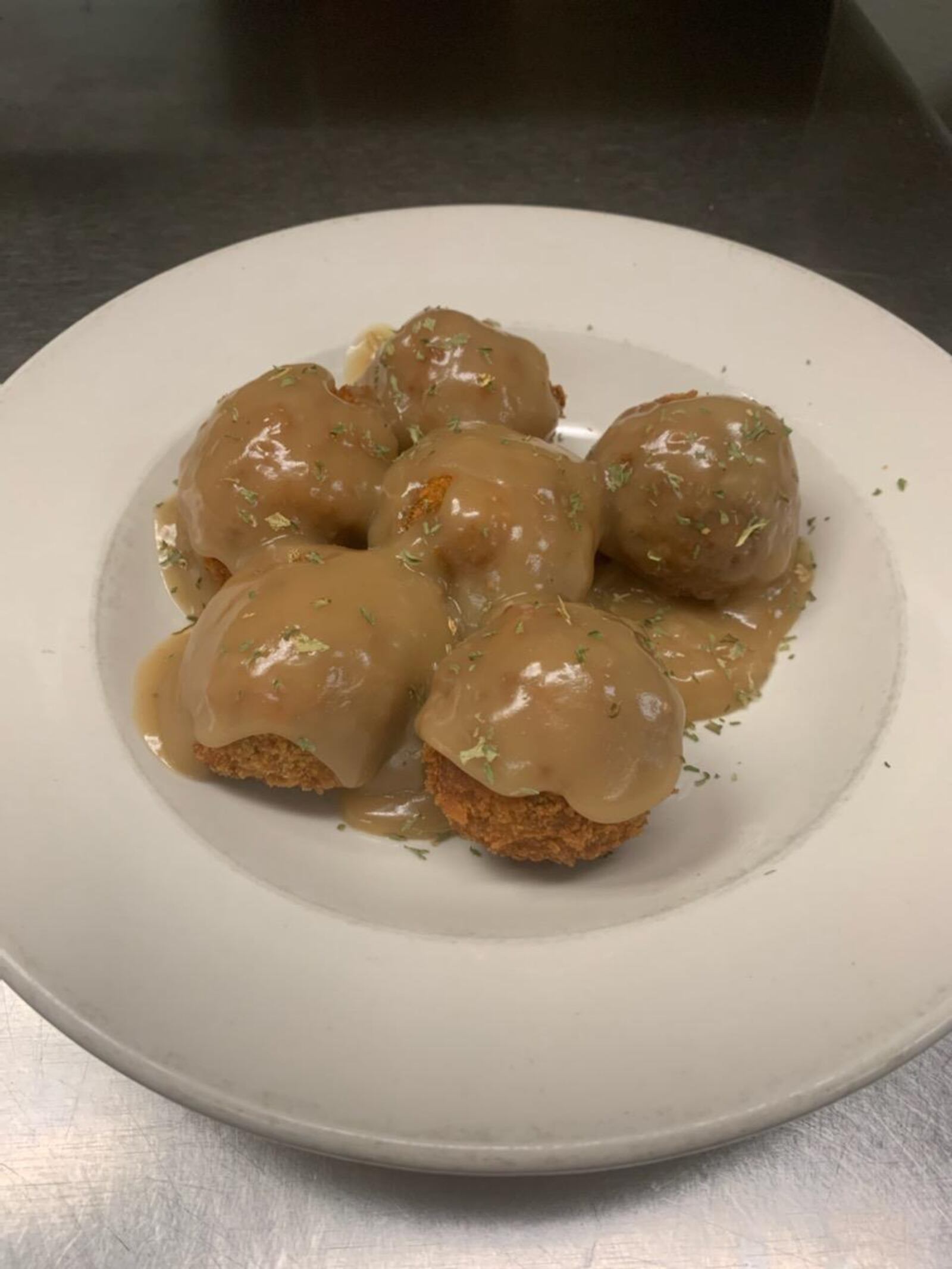 Romer's Turkey Balls feature a homemade savory blend of turkey, mashed potatoes, stuffing, lightly coated with panko bread crumbs and fried to a golden brown and served with turkey gravy. CONTRIBUTED