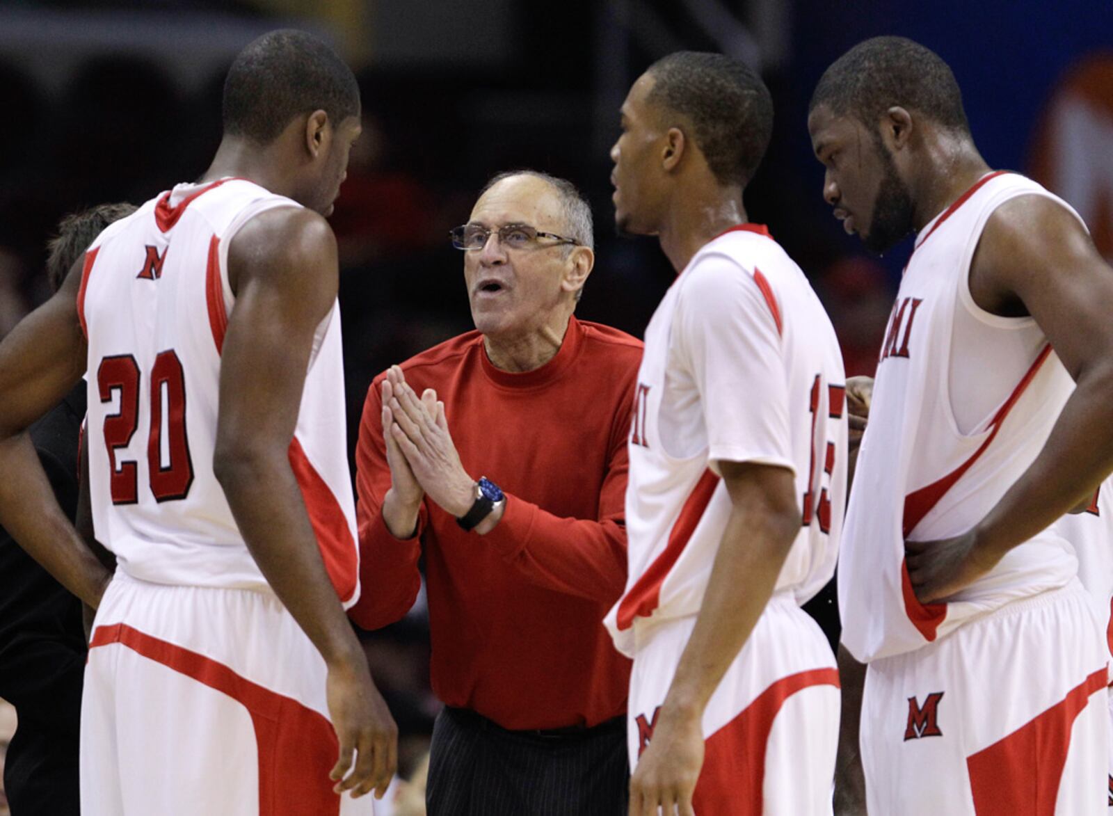 Miami University men's basketball coach Charlie Coles works with players during the 2011 MAC Tournament. 