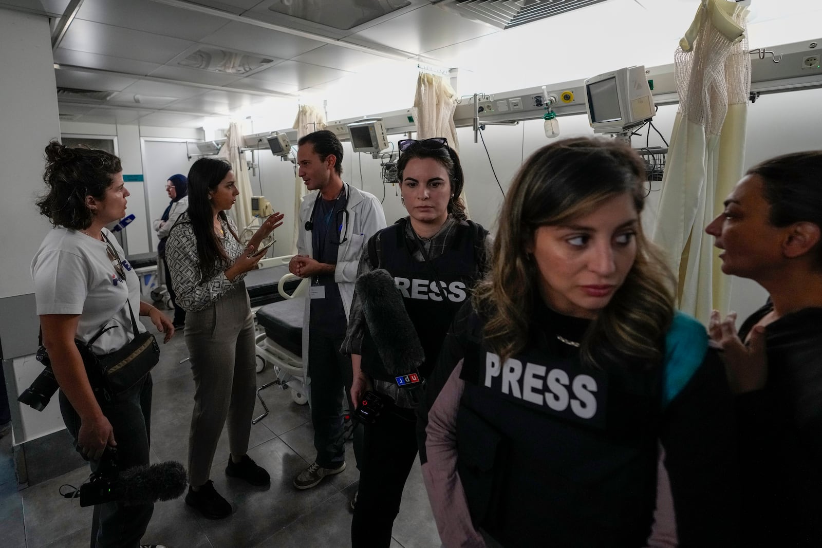 Foreign and local journalists take a tour inside Sahel General Hospital, in Dahiyeh, Beirut, Lebanon, Tuesday, Oct. 22, 2024, a day after the Israeli army said that Hezbollah is storing hundreds of millions of dollars in cash and gold under the hospital. (AP Photo/Hassan Ammar)