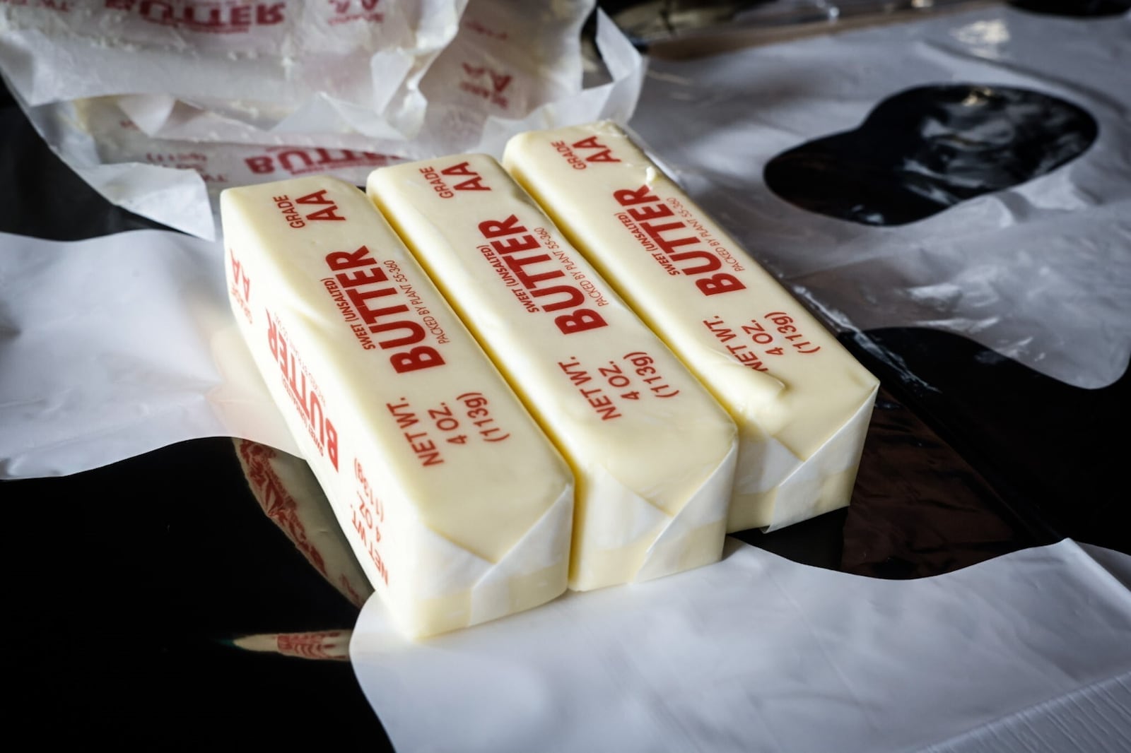 Food & Dining Reporter Natalie Jones and Publisher Suzanne Klopfenstein attempted to make their own butter cow in honor of the display at the Ohio State Fair. JIM NOELKER/STAFF