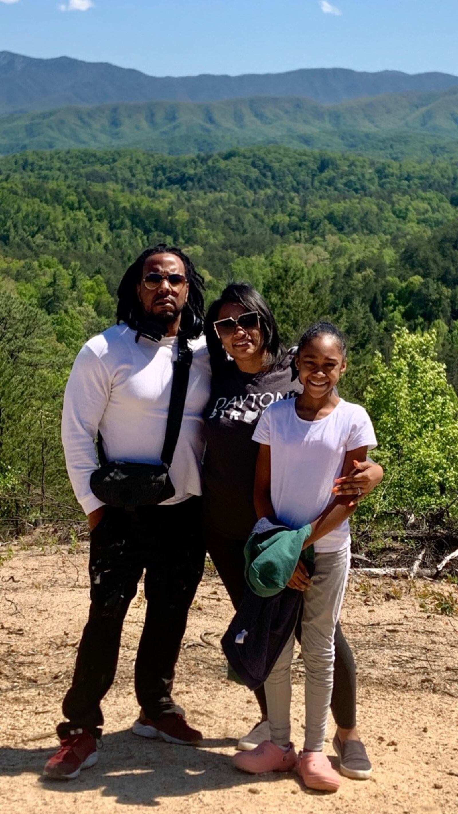 Dion Green, a survivor of the Memorial Day tornadoes and Oregon District mass shooting has penned the book "Untitled." His father Derrick Fudge died in the mass shooting.  Green is picture with his daughter Niara and fiancé Donita Cosey during a recent family trip to Gatlinburg, Tenn.