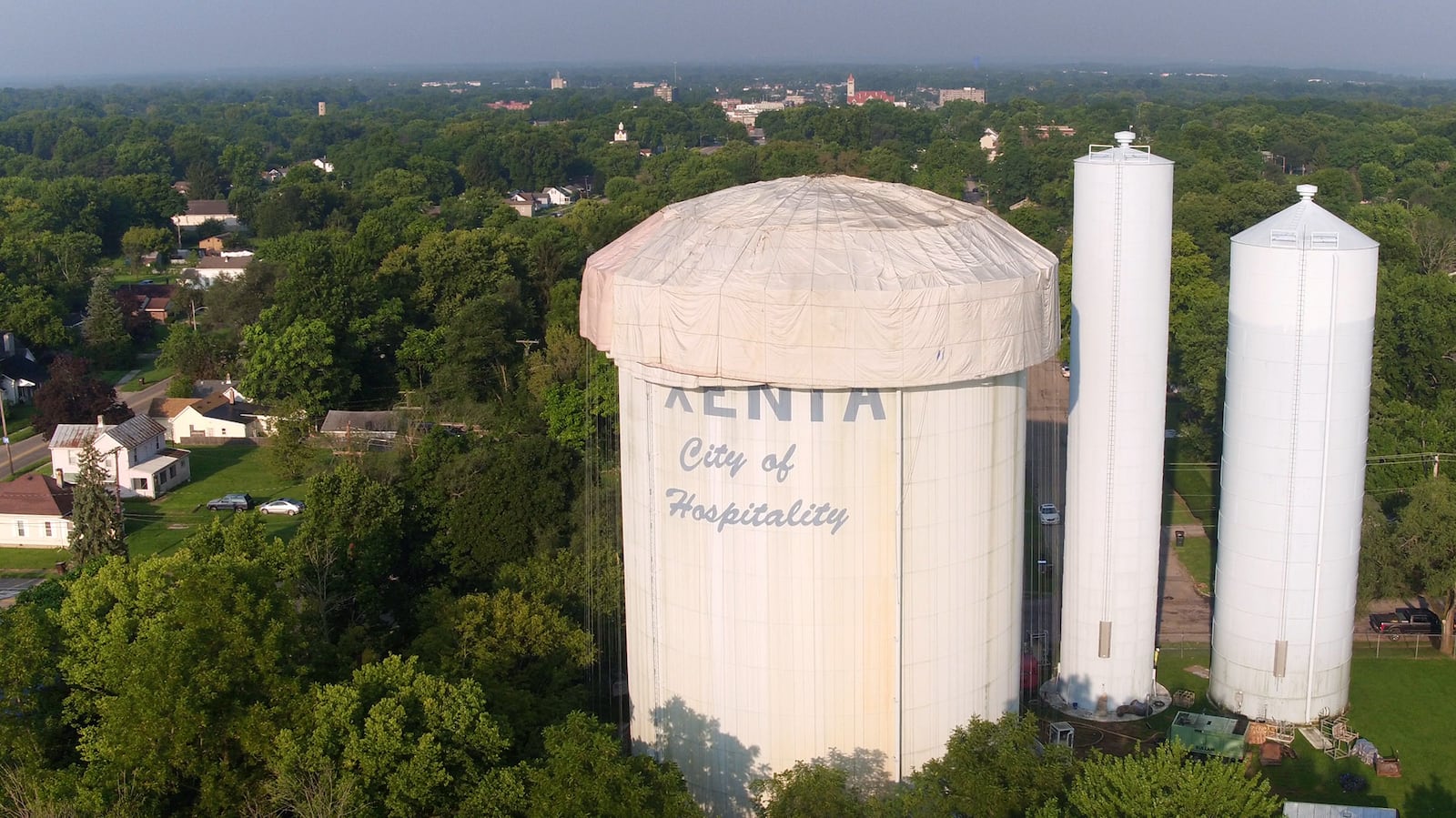 This three-million-gallon water tower, left, on Patton Street  in Xenia, is the second of two water towers to get repainted in the city this year.  The first tower is on W. Second Street and is almost complete.  The middle water tower in this photo was built in 1887.  It is still in use and believed to be the second oldest water tower in the country.      TY GREENLEES / STAFF