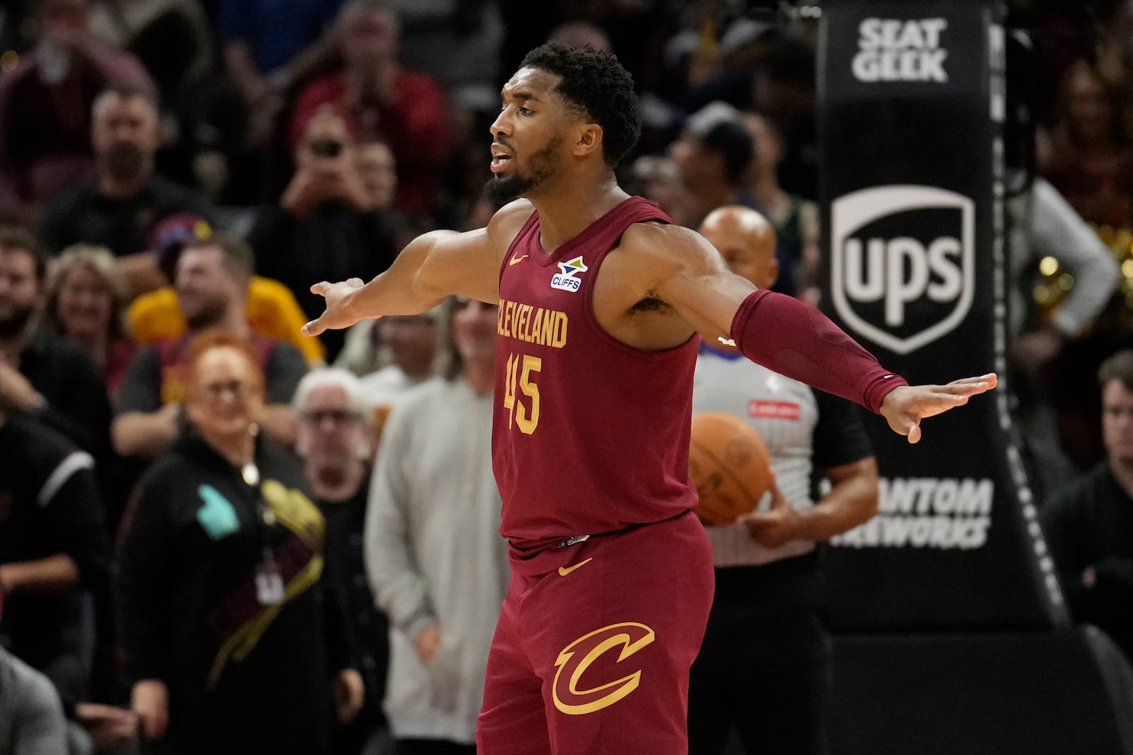 Cleveland Cavaliers guard Donovan Mitchell (45) gestures to his teammates late in the second half of an NBA basketball game against the Milwaukee Bucks, Monday, Nov. 4, 2024, in Cleveland. (AP Photo/Sue Ogrocki)