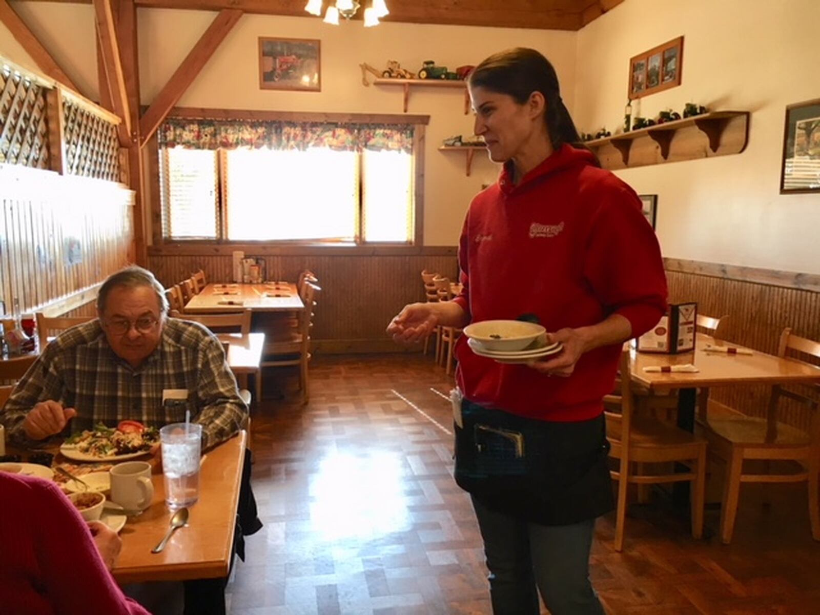 Brandi Ehrhart, a server at Young’s Golden Jersey Inn, says tips are an integral part of her job. Dan Young, owner of Young’s Jersey Dairy, said he doesn’t plan to change how his workers are tipped, even with a new proposed Labor Department rule on the horizon. THOMAS GNAU/STAFF