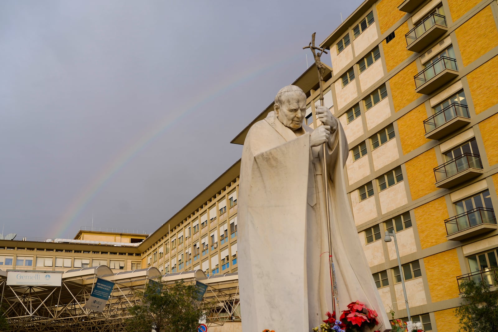 A rainbow shines over the Agostino Gemelli Polyclinic in Rome, Tuesday, Feb. 18, 2025, where Pope Francis was hospitalized Friday, Feb. 14, after a weeklong bout of bronchitis worsened and is receiving drug therapy for a respiratory tract infection. (AP Photo/Gregorio Borgia)