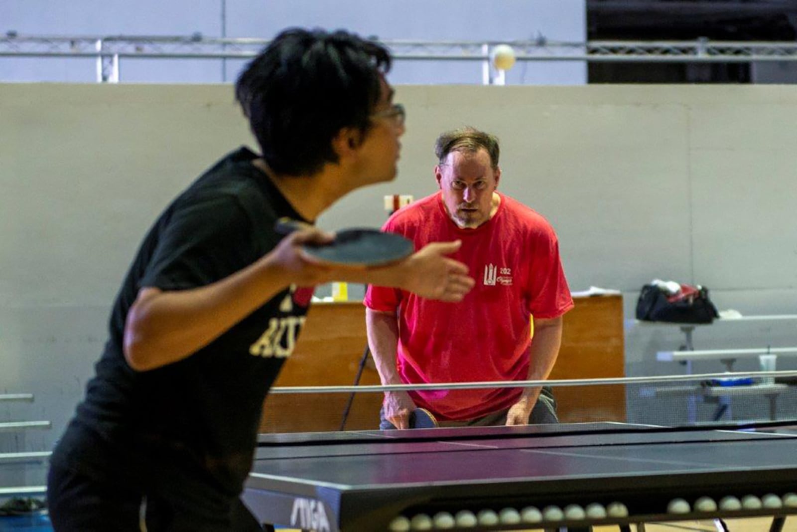 Ren Murakami, an Air Force Institute of Technology intern, prepares to hit a serve to his opponent in the quarterfinals of the Ping-Pong tournament Aug. 11 at Wright Field Fitness Center. U.S. AIR FORCE PHOTO/AIRMAN 1ST CLASS JAMES JOHNSON