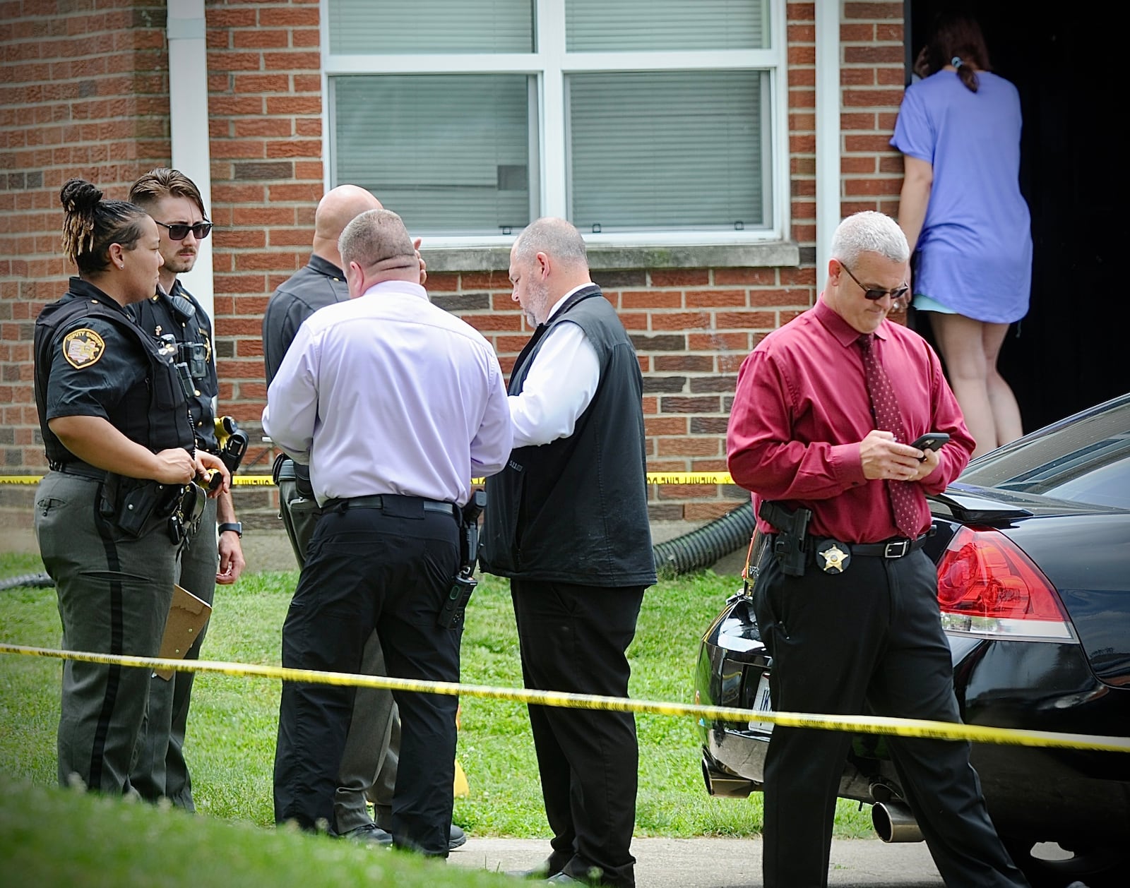 Montgomery County Sheriff's deputies stand outside apartments following a shooting Wednesday, June 8, 2022, on Republic Drive in Harrison Twp. MARSHALL GORBY/STAFF