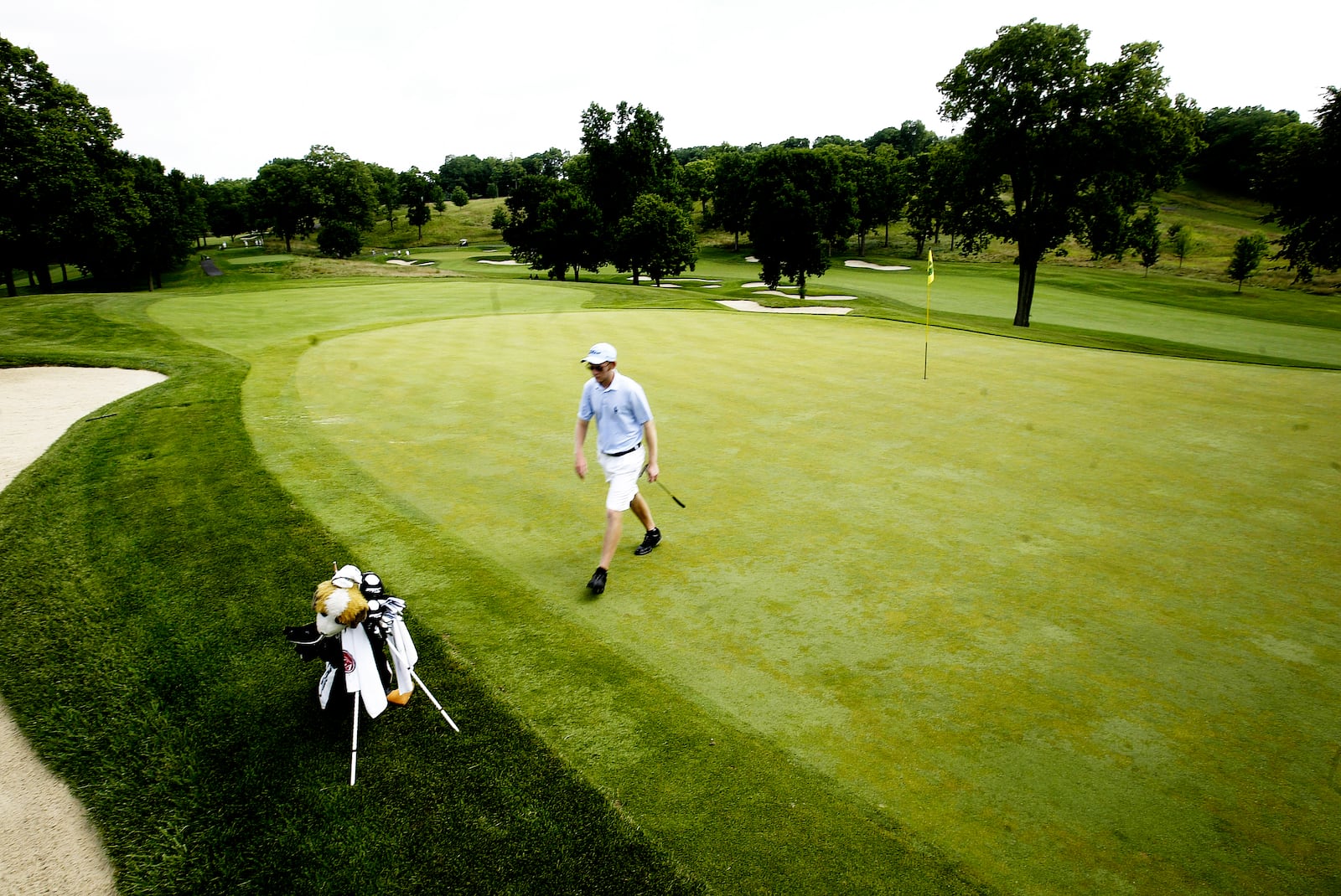 Former Ohio Amateur champ, Michael Bernard walks off of 15 during the first round of Ohio Amateur Tuesday July 12, 2011, at the NCR Country Club. STAFF PHOTO JIM NOELKER