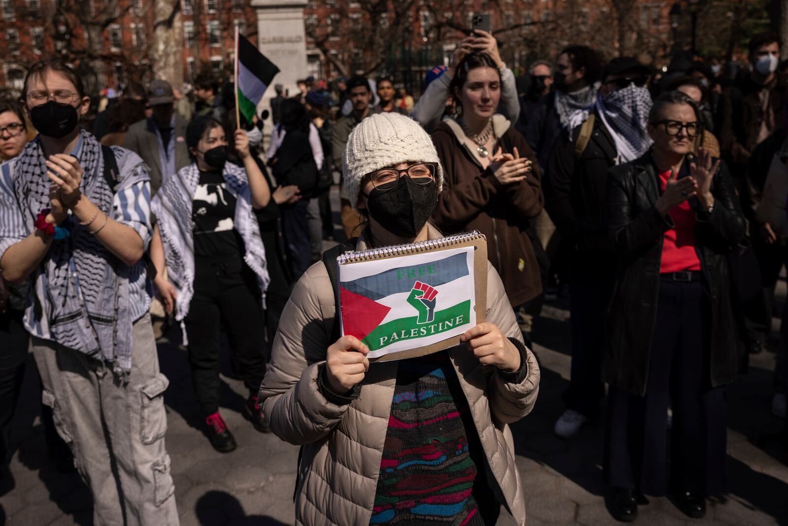 A protester including students of New York University gather for a demonstration in support of Palestinian activist Mahmoud Khalil at Washington Square Park, Tuesday, March 11, 2025, in New York. (AP Photo/Yuki Iwamura)