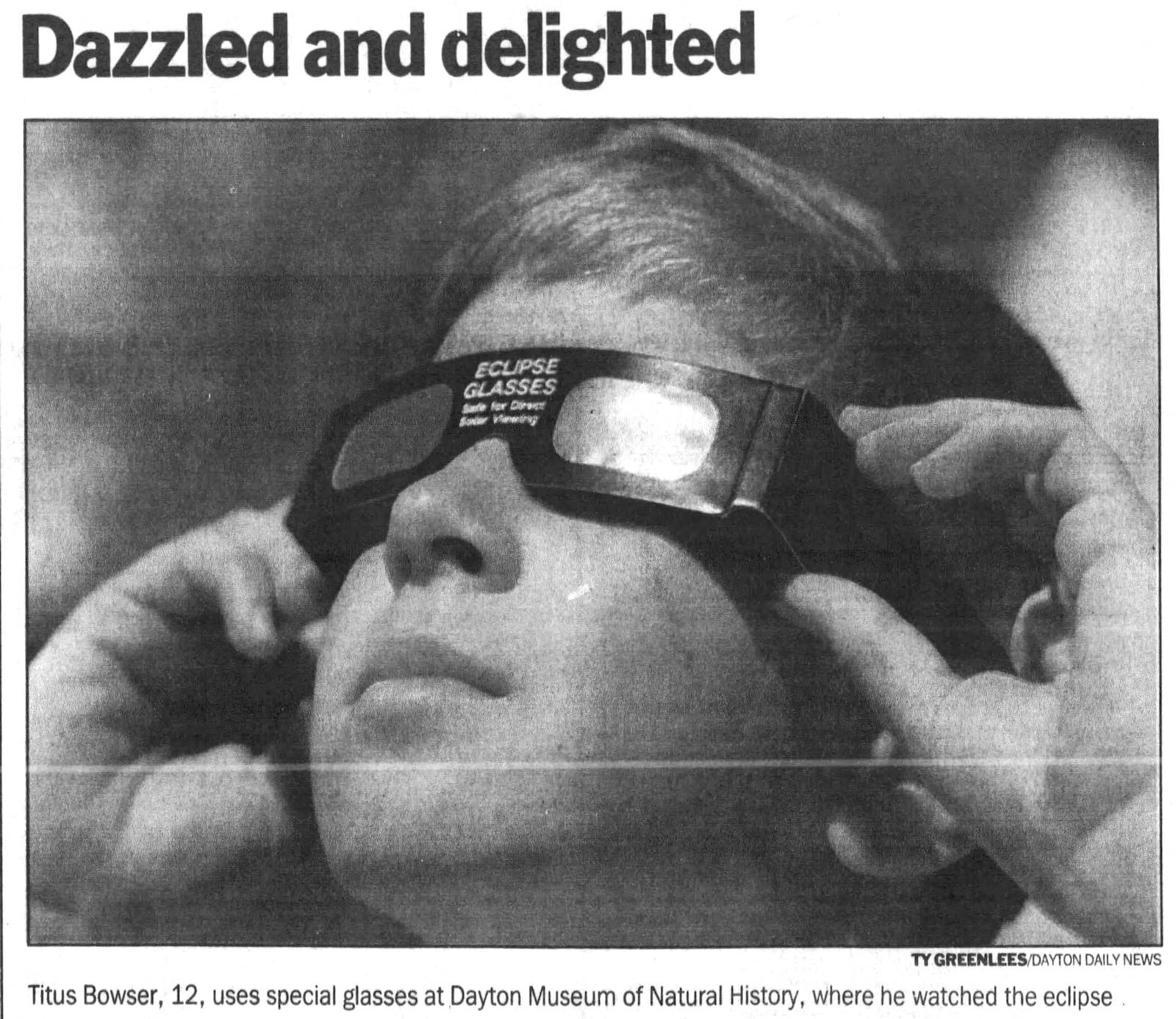 Titus Bowser, 12, uses special glasses at the Dayton Museum of Natural History to view the partial solar eclipse May 10, 1994. DAYTON DAILY NEWS ARCHIVES