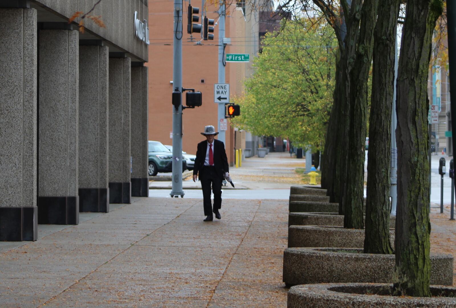 A man walks up Ludlow Street in downtown Dayton on Wednesday. CORNELIUS FROLIK / STAFF