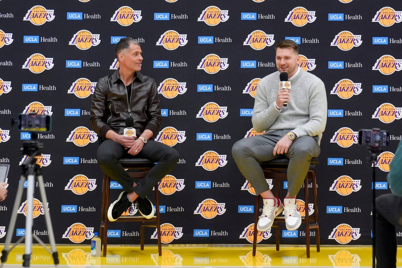 Los Angeles Lakers' Luka Doncic speaks next to general manager Rob Pelinka during an introductory NBA basketball press conference Tuesday, Feb. 4, 2025, in El Segundo, Calif. (AP Photo/Jae C. Hong)