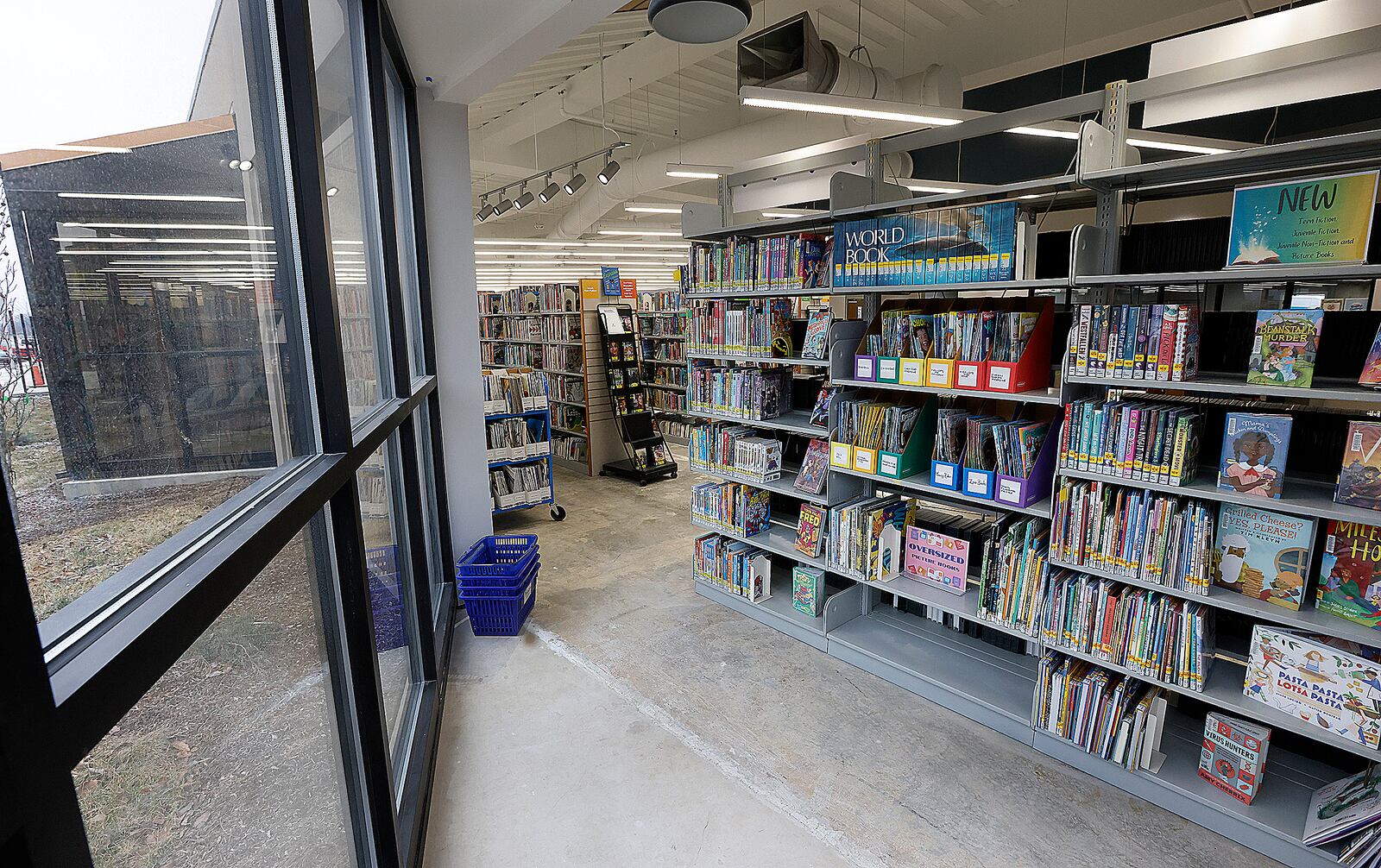 The stacks at the Xenia Community Library have much more light coming from the reading alcoves, as part of the library's ongoing $8.7 million renovation, Feb. 12, 2025. MARSHALL GORBY\STAFF