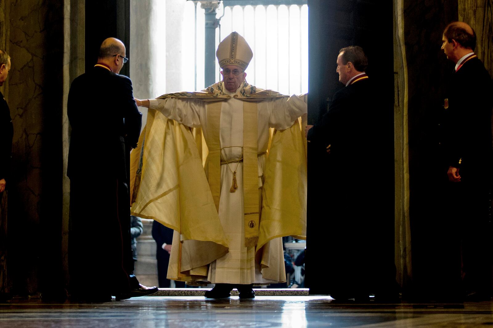 FILE - Pope Francis opens the Holy Door of St. Peter's Basilica at the Vatican, Tuesday, Dec. 8, 2015. (AP Photo/Andrew Medichini, File)