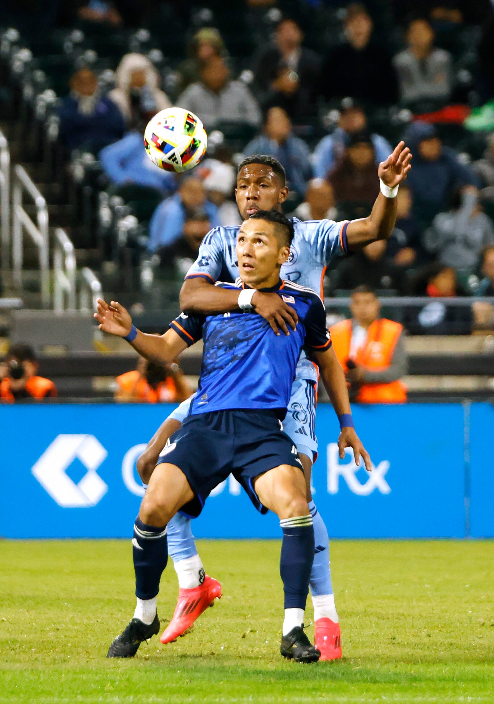 New York City FC Andres Perea (8) fights for the ball with FC Cincinnati's Yuya Kubo (7) during a soccer match of the MLS Cup playoffs, Saturday, Nov. 2, 2024, in New York. (AP Photo/Kena Betancur)