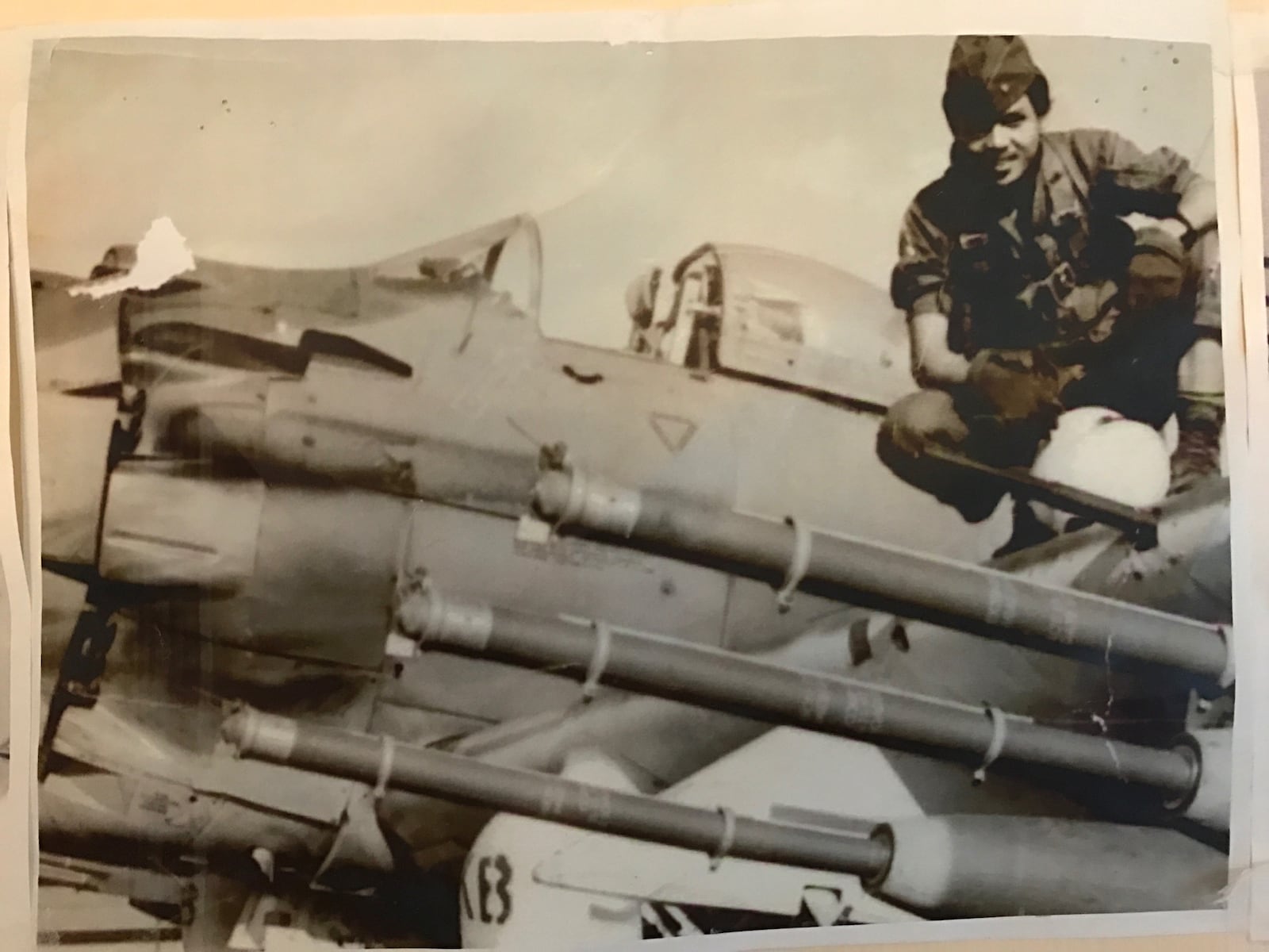 Pilot Ba Nguyen on the wing of his A-1 Skyraider that’s loaded with long fuse Mk 82 missiles. Based at Bien Hoa Air Base, he flew some 1,500 combat missions for the Republic of Vietnam Air Force (RVNAF).     (Contributed Photo)