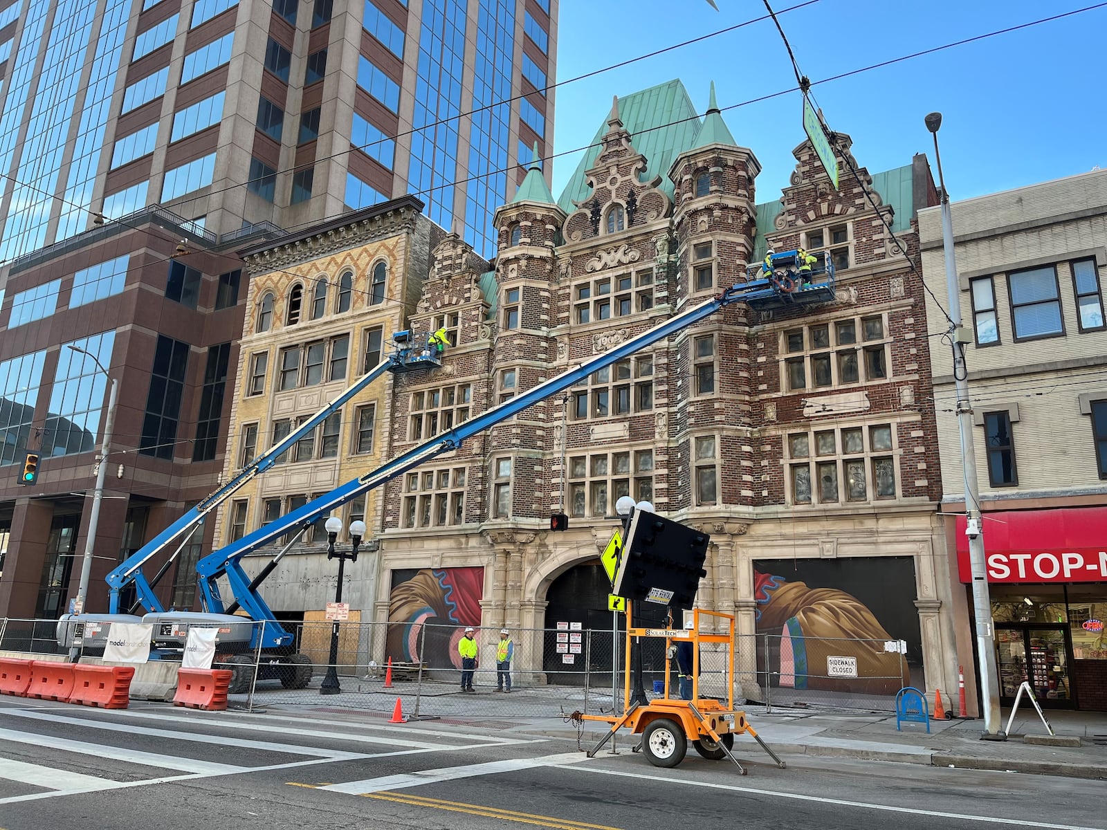 Crews work on the façade of the Dayton Arcade along West Third Street on Wednesday morning, April 12, 2023. Developers plan to turn the two north Arcade buildings into a new hotel and a mix of retail. CORNELIUS FROLIK / STAFF