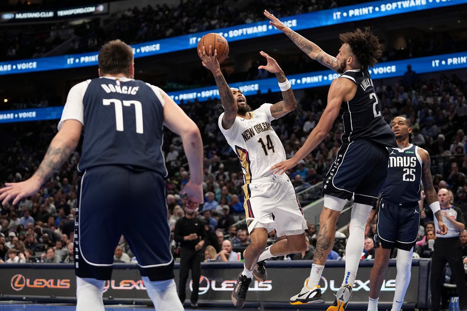 New Orleans Pelicans forward Brandon Ingram (14) shoots as Dallas Mavericks' Dereck Lively II (2) defends in the second half of an Emirates NBA Cup basketball game in Dallas, Tuesday, Nov. 19, 2024. (AP Photo/Tony Gutierrez)