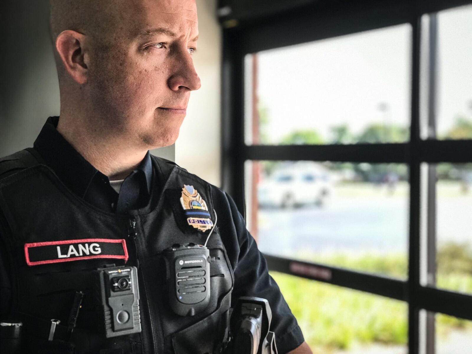 Englewood police Sgt. Mike Lang wears a WatchGuard body camera.  JIM NOELKER / STAFF