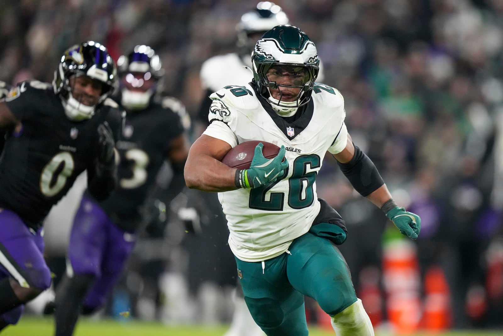 Philadelphia Eagles running back Saquon Barkley (26) runs with the ball against the Baltimore Ravens during the second half of an NFL football game, Sunday, Dec. 1, 2024, in Baltimore. (AP Photo/Stephanie Scarbrough)