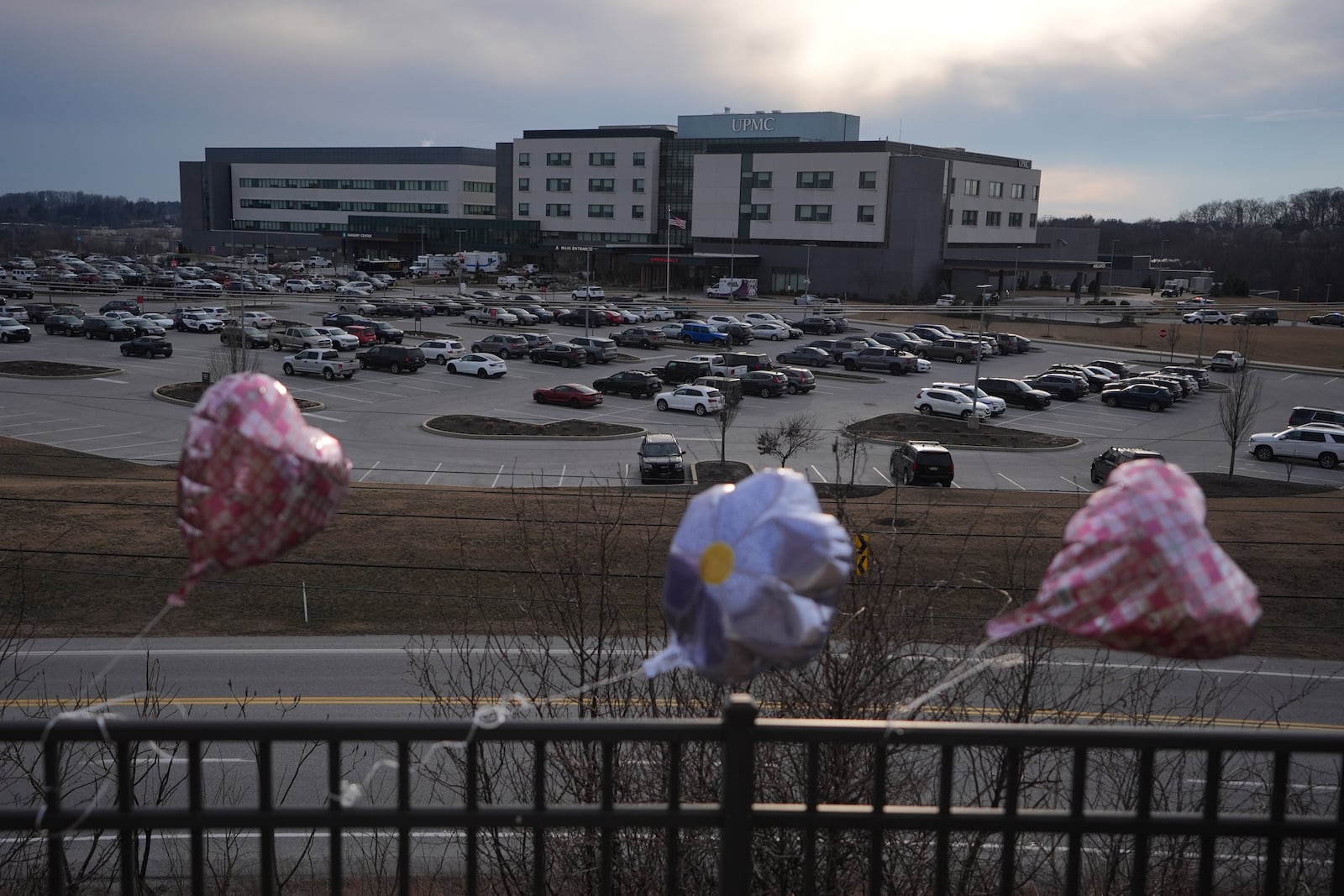 Balloons are placed in front of UPMC Memorial Hospital after a deadly shooting in York, Pa. on Saturday, Feb. 22, 2025. (AP Photo/Matt Rourke)