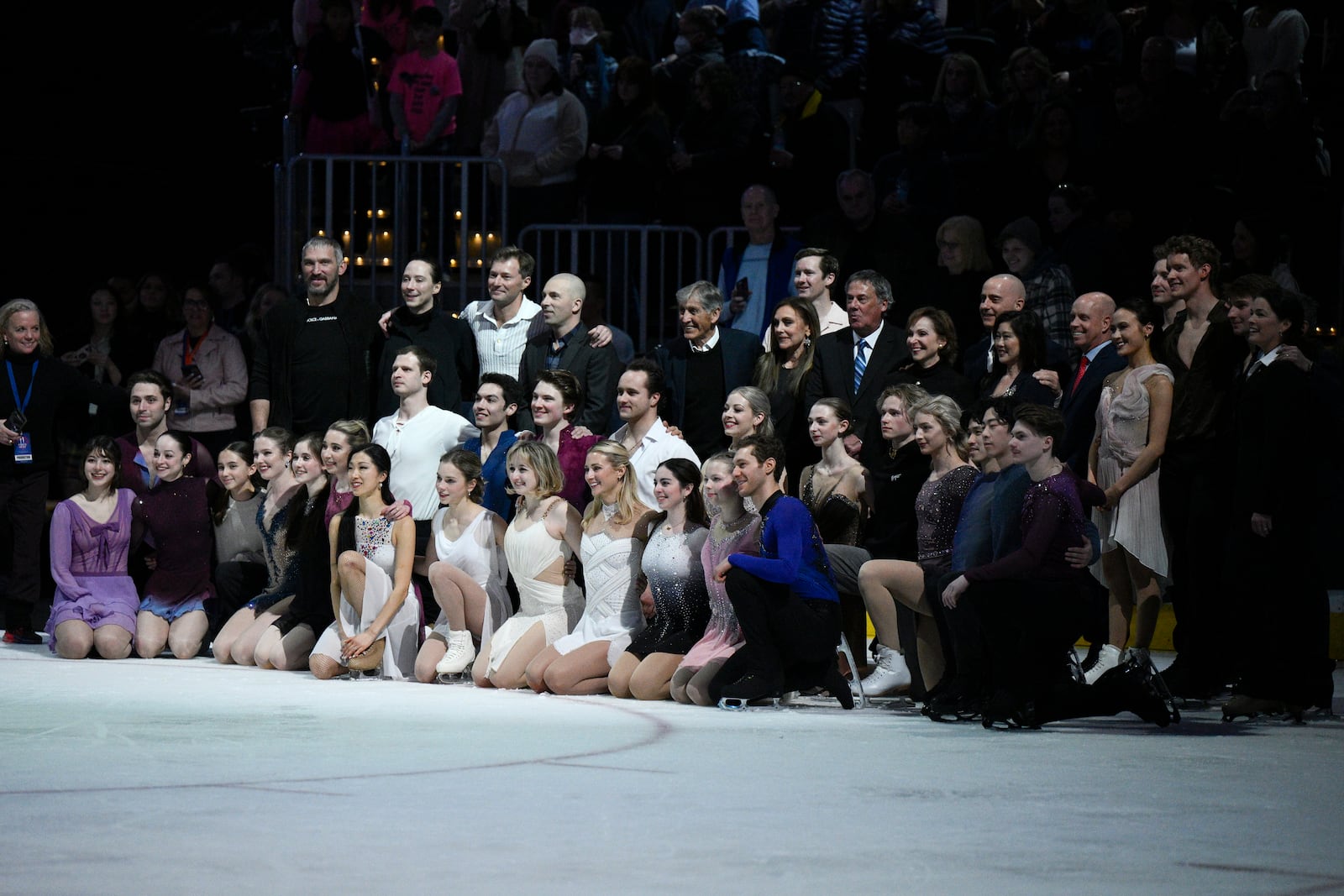 Washington Capitals player Alex Ovechkin, back row left, joins cast members for a photo Sunday, March 2, 2025, in Washington after the Legacy on Ice event, a figure skating tribute to support the families and loved ones affected by the Jan. 29, 2025, aviation incident. (AP Photo/Nick Wass)