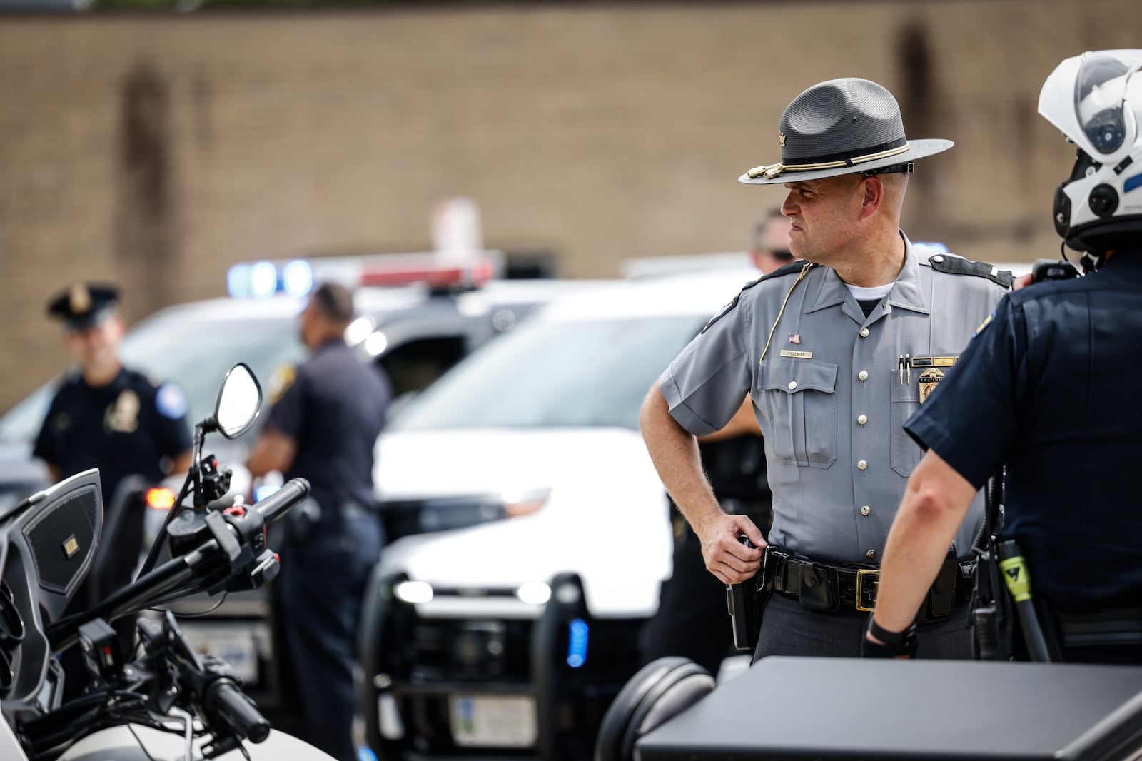 Lt. Geoff Freeman of the Dayton Post of the Ohio Highway Patrol talks to other officers during a press conference concerning impaired driving. Jim Noelker/Staff