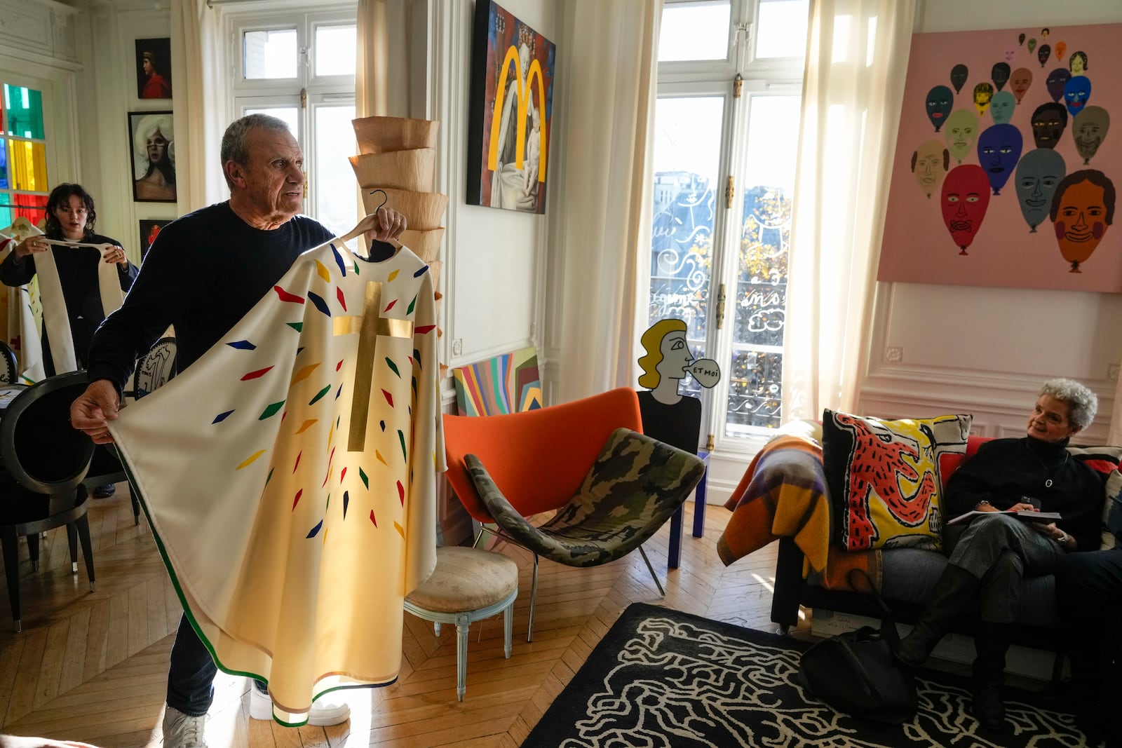 Designer Jean-Charles de Castelbajac displays a liturgical vestment for priests to be worn at the reopening of Paris' Notre-Dame cathedral in December, Wednesday, Nov. 20, 2024 in Paris. (AP Photo/Michel Euler)