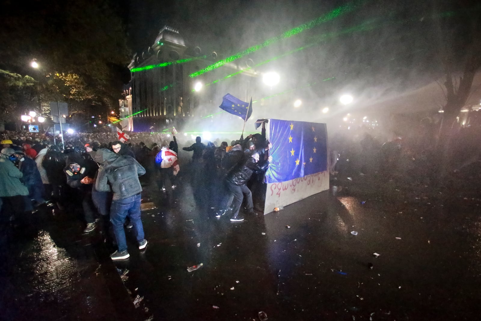 Police use a water cannon to prevent protesters pouring into the streets following Georgian Prime Minister Irakli Kobakhidze's announcement, rallying outside the parliament building in Tbilisi, Georgia, on Friday, Nov. 29, 2024. (AP Photo/Zurab Tsertsvadze)