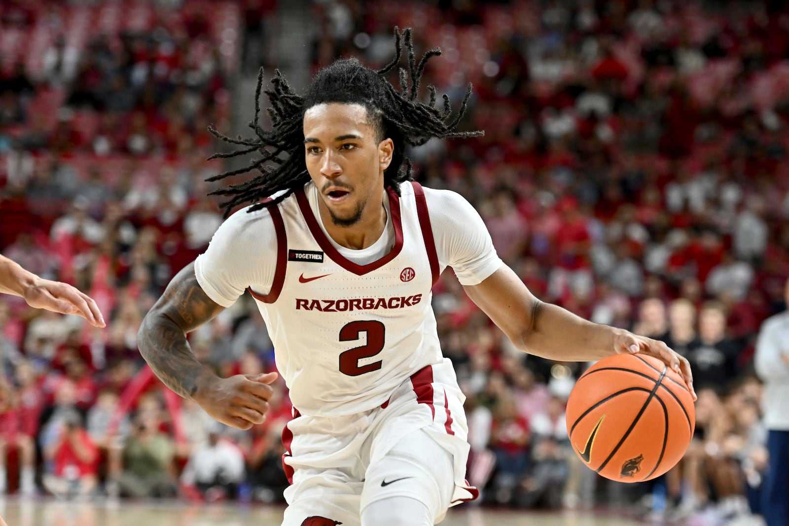 Arkansas guard Boogie Fland (2) drives to the hoop against Lipscomb during the second half of an NCAA college basketball game Wednesday, Nov. 6, 2024, in Fayetteville, Ark. (AP Photo/Michael Woods)