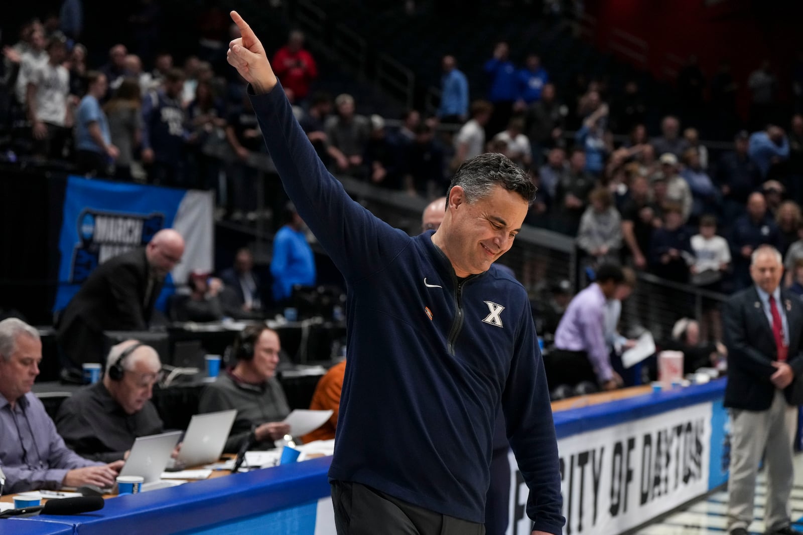 Xavier head coach Sean Miller gestures to fans following their victory over Texas during a First Four college basketball game in the NCAA Tournament, Wednesday, March 19, 2025, in Dayton, Ohio. (AP Photo/Jeff Dean)